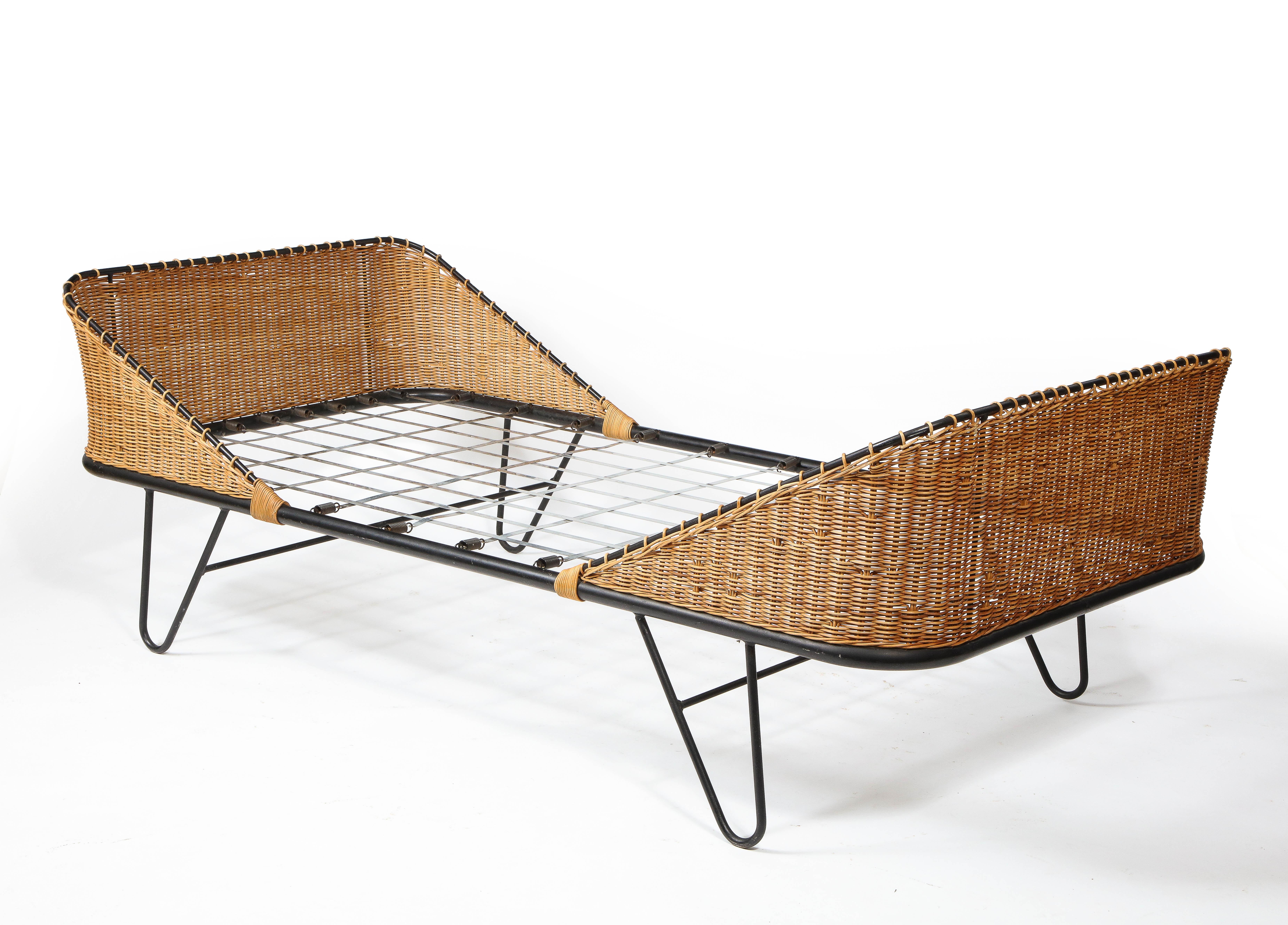 Elegant wrought iron & wicker daybed by Raoul Guy. COM available, a second daybed is also available.