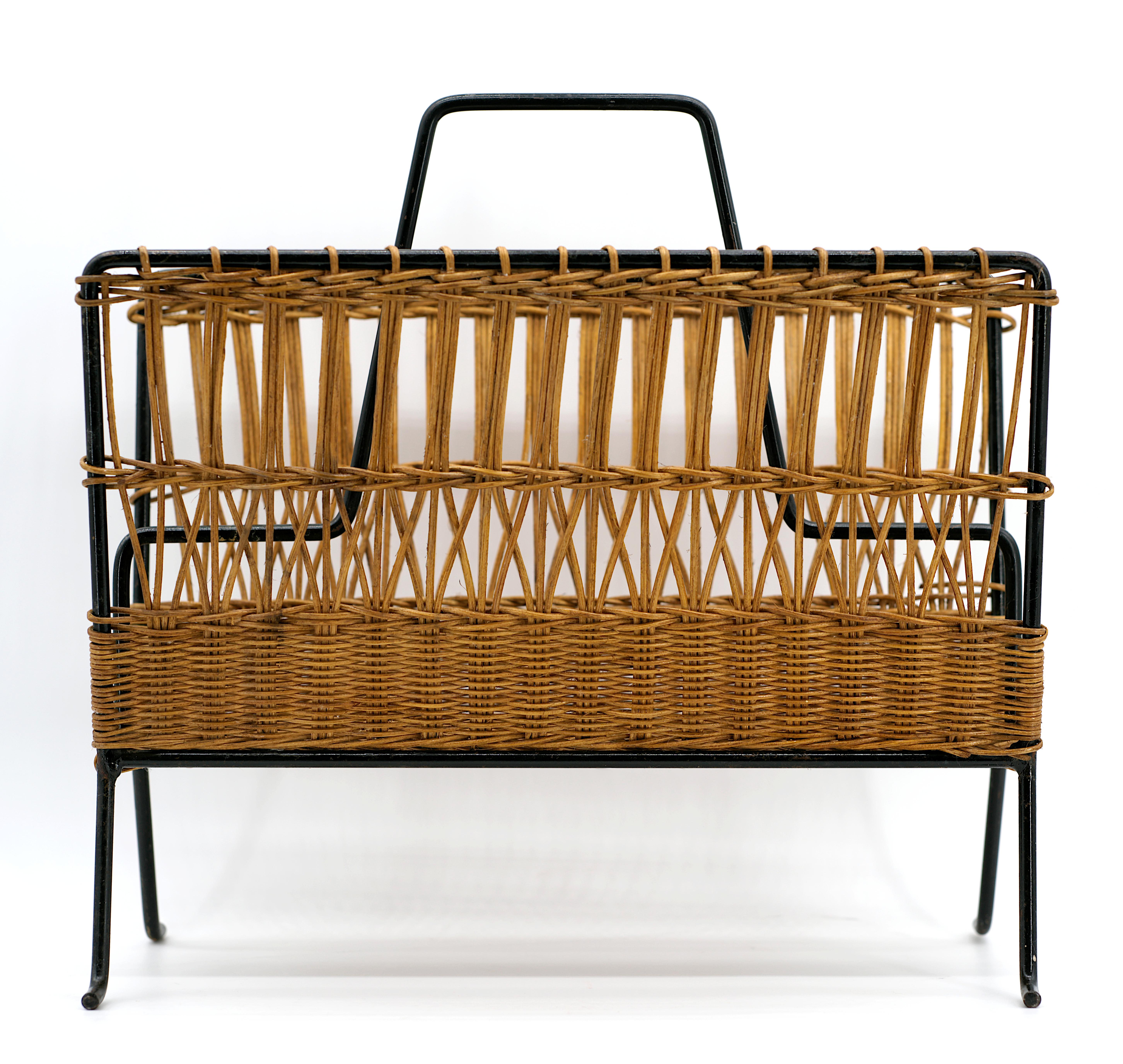 French midcentury magazine rack by Raoul Guys, France, 1960s. Wicker and iron. Height 15.75