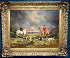 English Fox Hunt Riders and Hounds in an extensive landscape