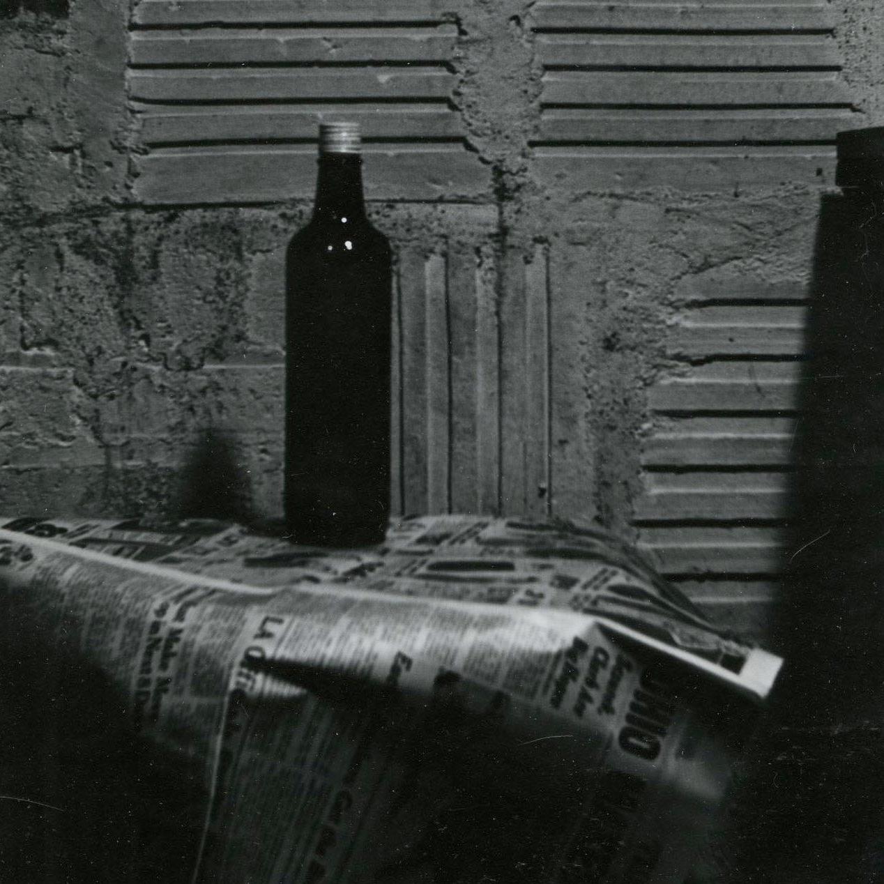 Still Life with bottle and newspaper - Photograph by Raphael Gleitsman