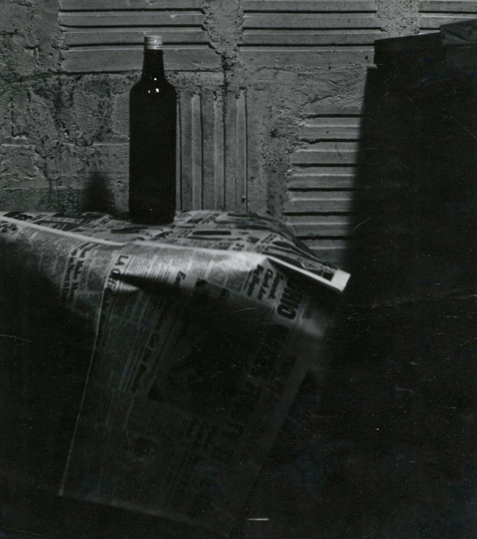 Still Life with bottle and newspaper
Silver gelatin print, 1950's, printed 1967
Signed in pencil on the mount lower right
Provenance: Gift of the Artist
                      Akron Art Museum
                      De-accessed 2025
Condition: