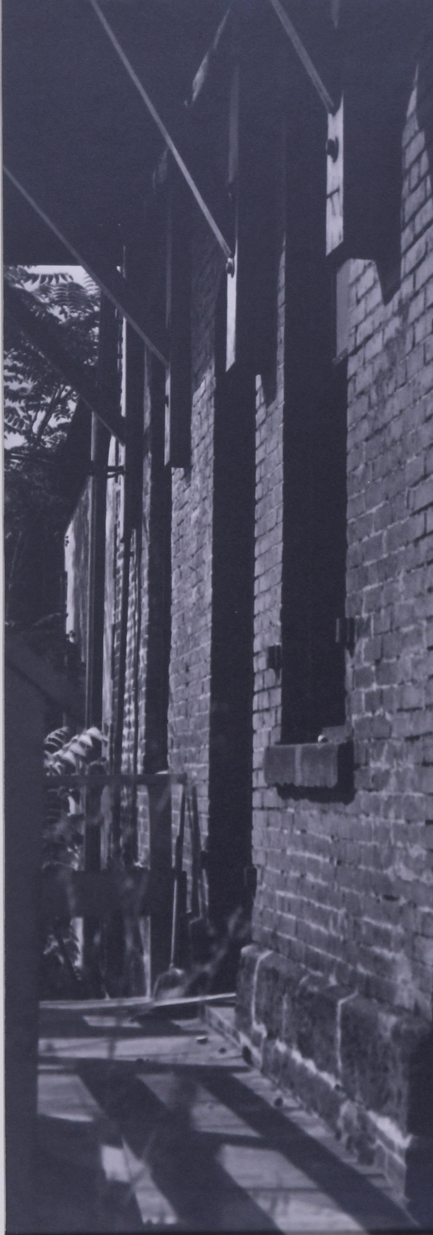 untitled (study of shadows and brick building) - Photograph by Raphael Gleitsman