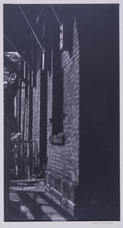 untitled (study of shadows and brick building)