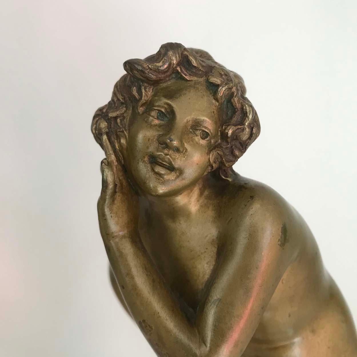 A beautiful small cast bronze figurine of a naked woman by Italian sculptor Raphael Nannini, mounted on a stepped veined marble base.

Raphaël Nannini was born in Florence and there executed bronzes and ivory figures for French foundries like Les