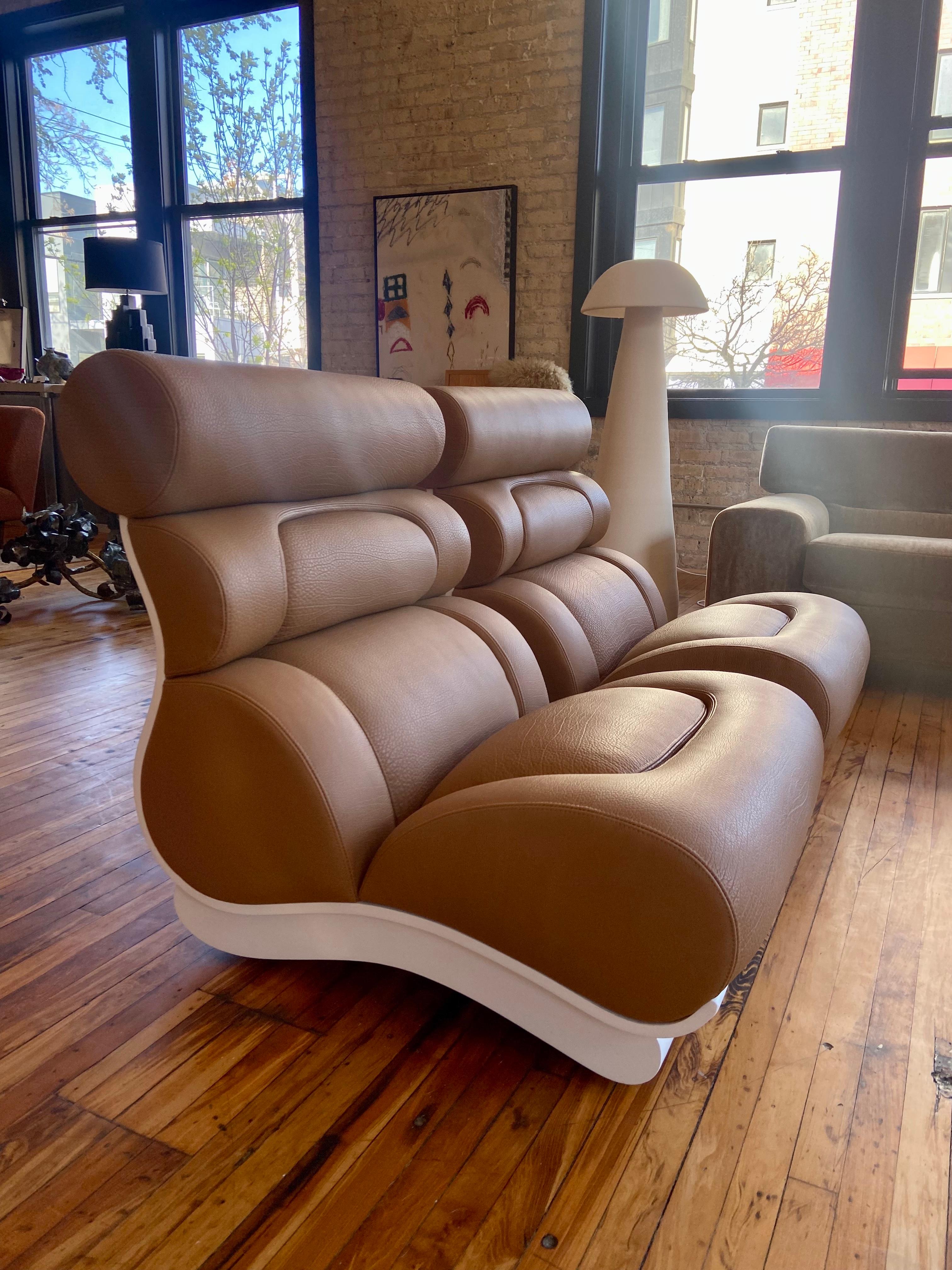 Incredibly cool lounge chairs designed by Raphael Raffel, circa 1960s. The rolled ergonomic back and seat supports create an unmistakable profile reminiscent of automobile designs. Perhaps surprisingly the backs and bases are formed from bent wood;