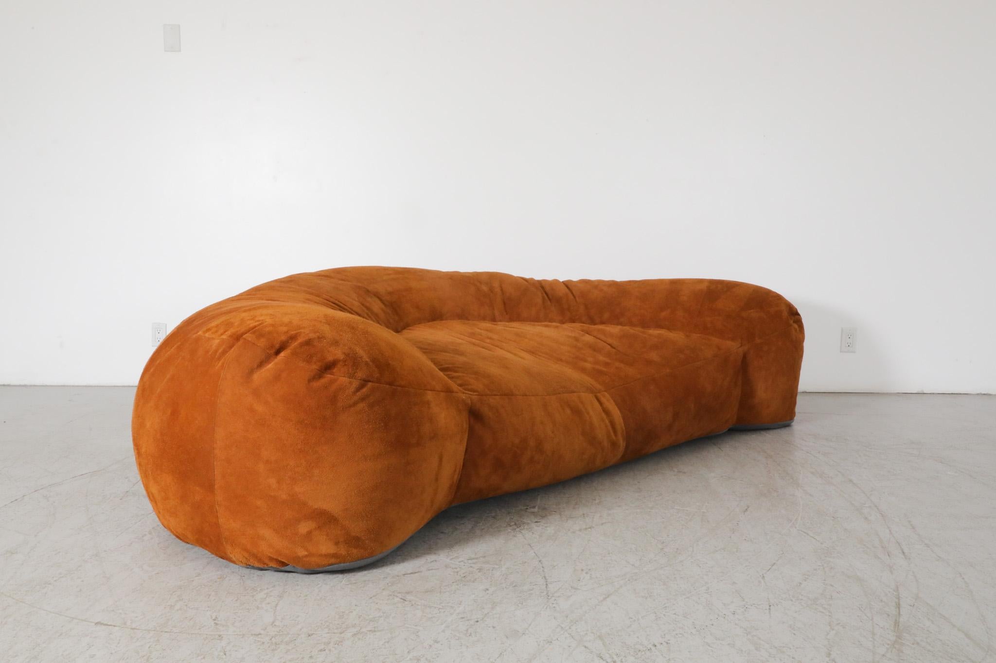 This is a 1970's, made-to-order, suede upholstered, Croissant Sofa for Honore Paris. 
Design is attributed to the famous Raphael Raffel (1912-2000). Raffel, who trained at the École des Beaux Arts, was a well-known interior decorator whose work was