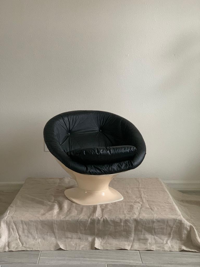 Space age tub chair designed by French designer Raphael Raffel. This particular version created using fiberglass for the frame: ( other versions produced used molded plastic)

Upholstered in leather and vinyl.

Raphael Raffel, was a notable figure