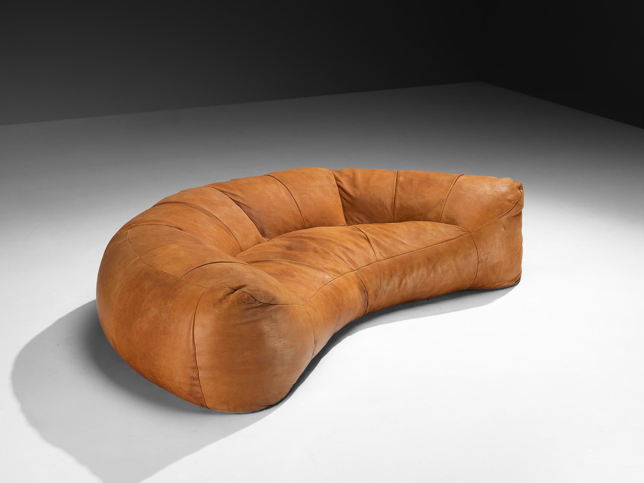 Raphael Raffel for Honore Paris 'Croissant' sofa, leather, France, 1970s 

An iconic and sculptural sofa designed by Raphael Raffel for Honore Paris during the 1970s. This particular piece is upholstered in beautifully patinated buffalo leather in a