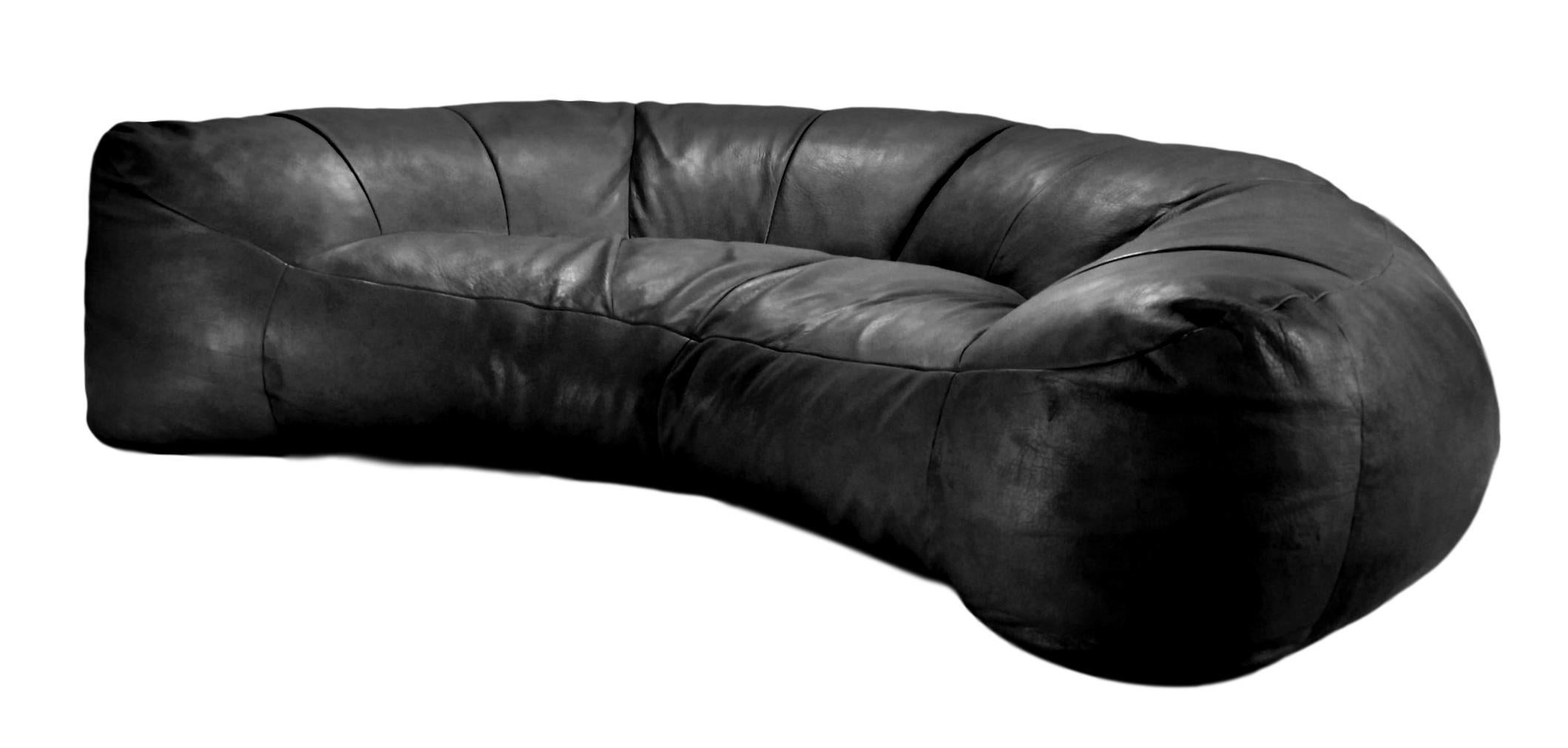 Stunning leather sofa by Raphael Raffel for Honore, Paris. Made to order back in the 1970s and seldom available for purchase. Black leather sofa in the shape of a giant croissant. Good vintage condition.