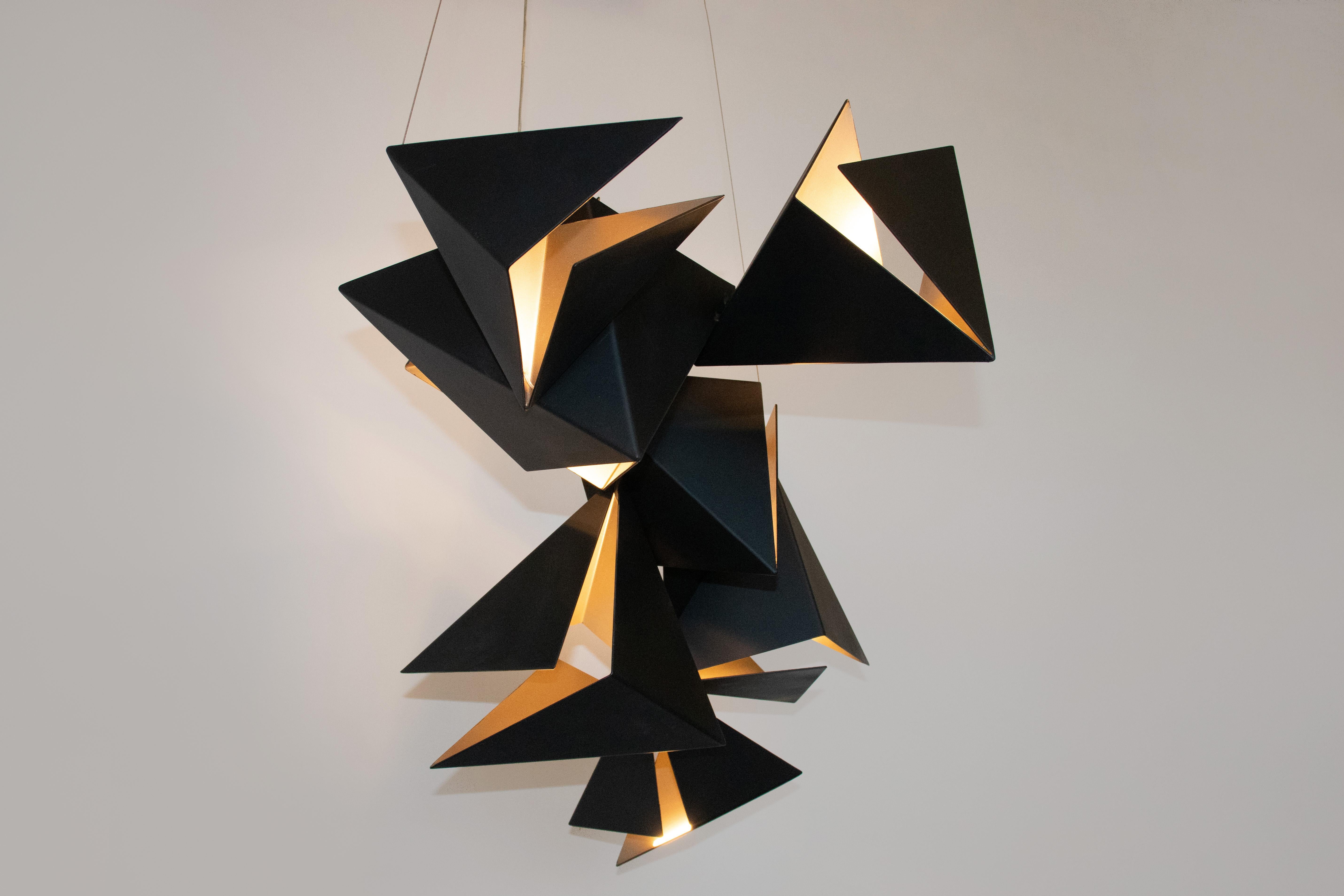 The Rapture pendant is a dynamic grouping of geometric brake formed pendants with a two-tone finish to highlight the internal LED light source. The RAPTURE Pendant comes in groupings of 3, 5 and 7 formed diffusers. These can be suspended as single