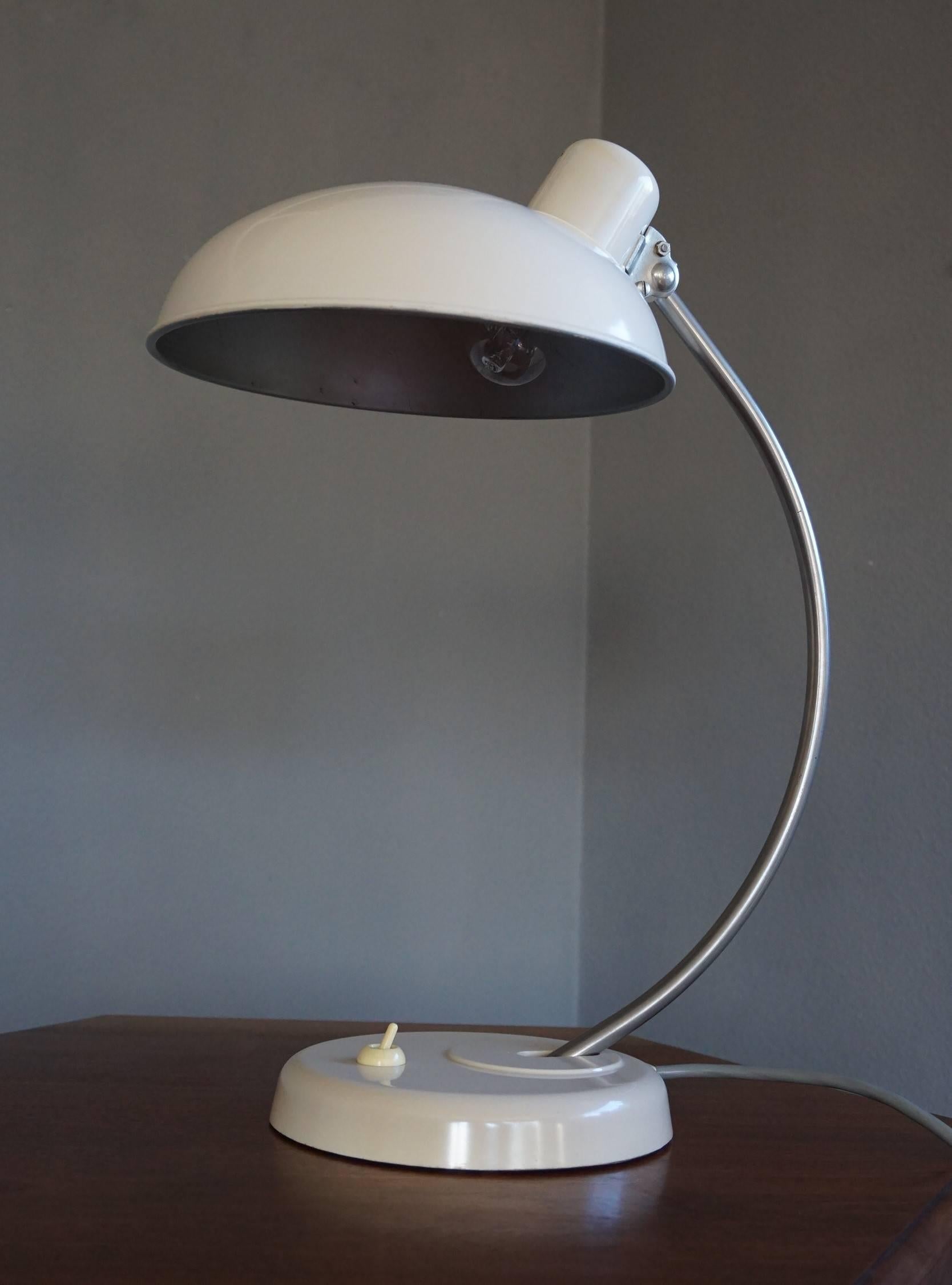 Very rare white bakelite Helion design lamp.

The combination of the design and the use of materials is what makes this rare Helion desk lamps such a wonderful sight to see. The fact that the arm and shade are adjustable and the fact that the light