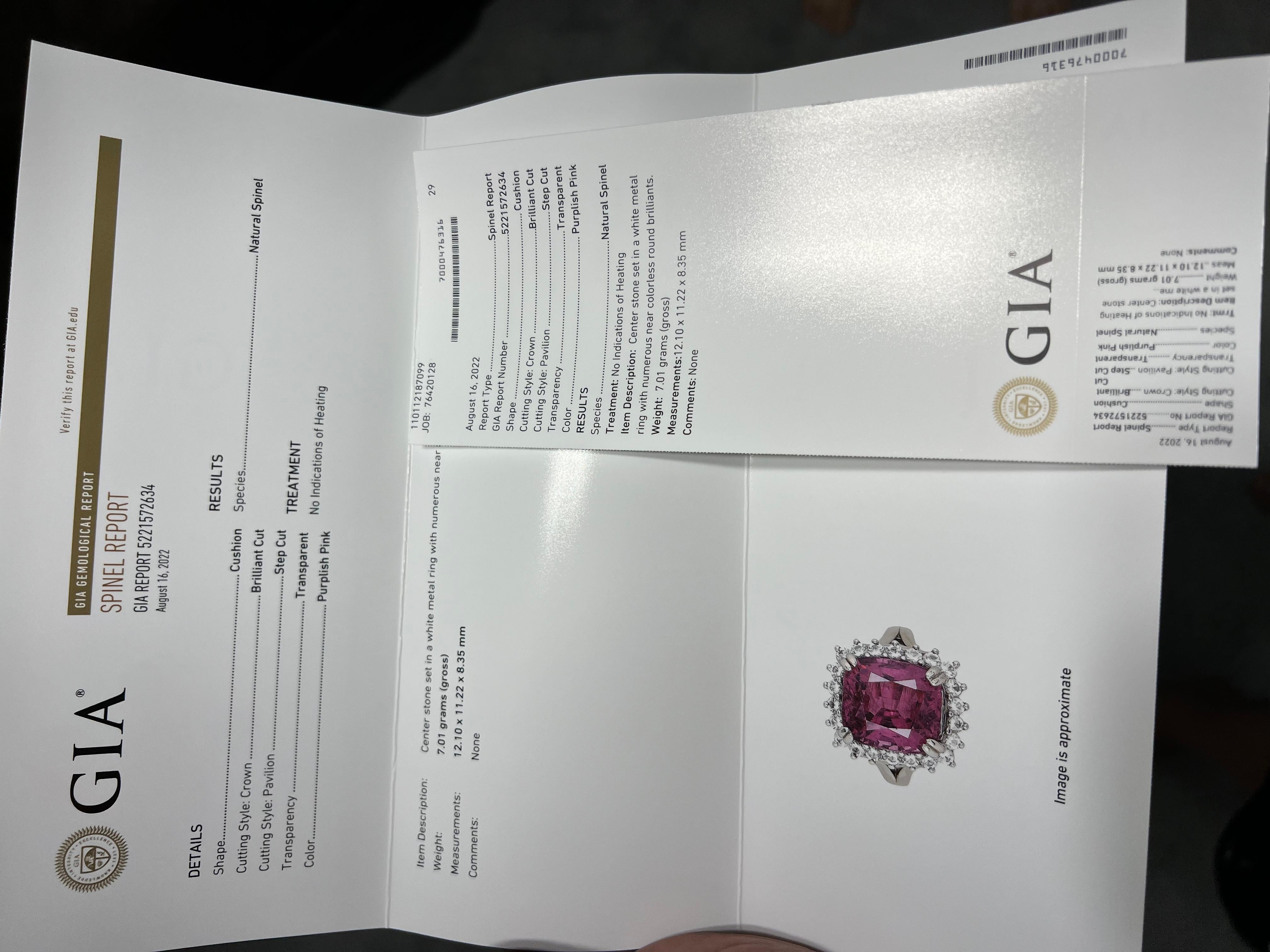 This beautiful GIA certified 10.3 carat Purplish Pink Spinel is one of the once in a lifetime finds and opportunities a savvy collector and fine jewel lover can possess. It has been beautifully Preset in 925 Sterling Silver Ring with natural Topaz