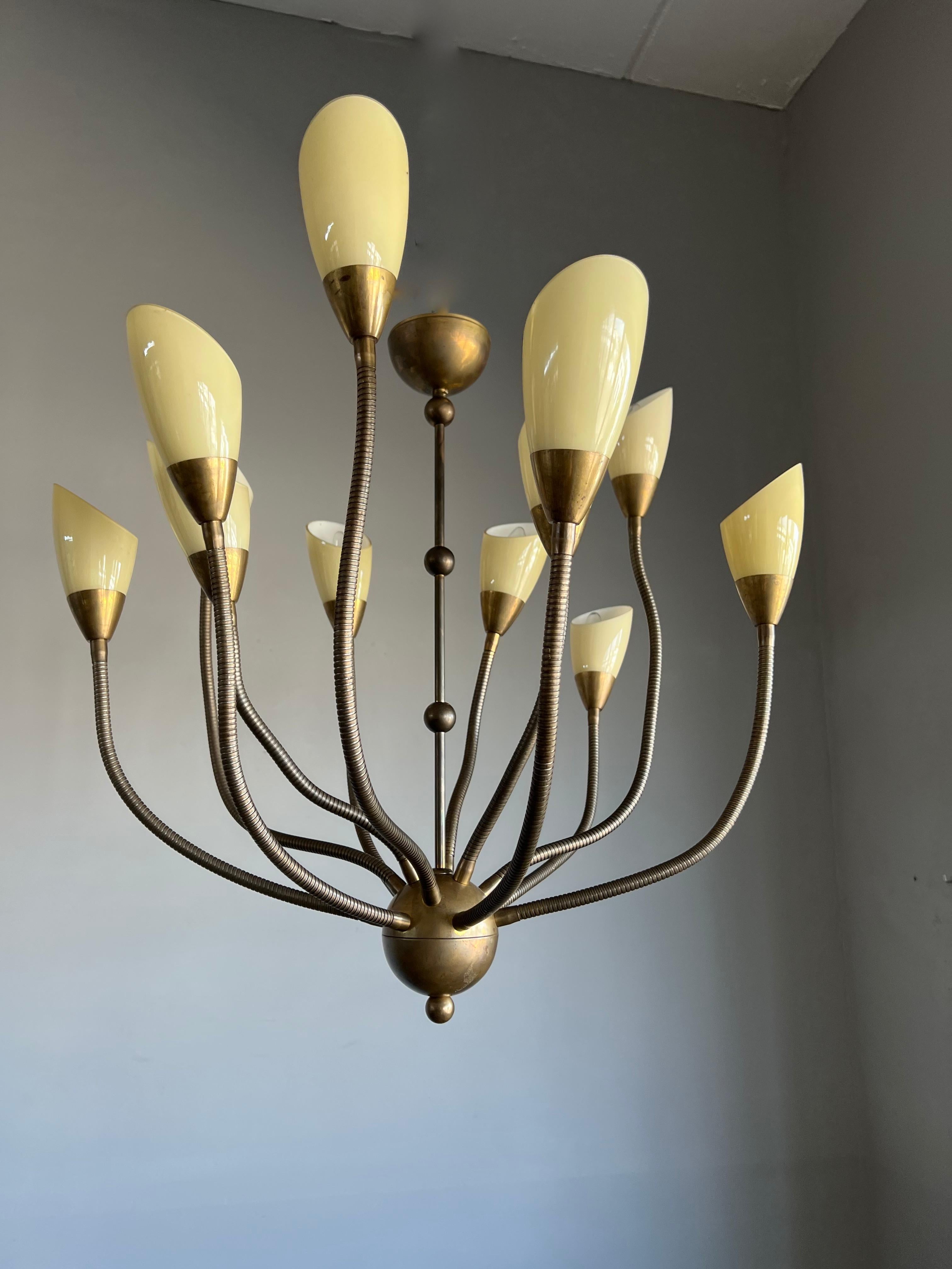 Large size and great design, 'multi-shapable' pendant light.

If you are looking for a beautiful and truly stylish pendant for a midcentury, for an Art Deco or for a contemporary  interior then this cool chandelier (of which we have three) could be