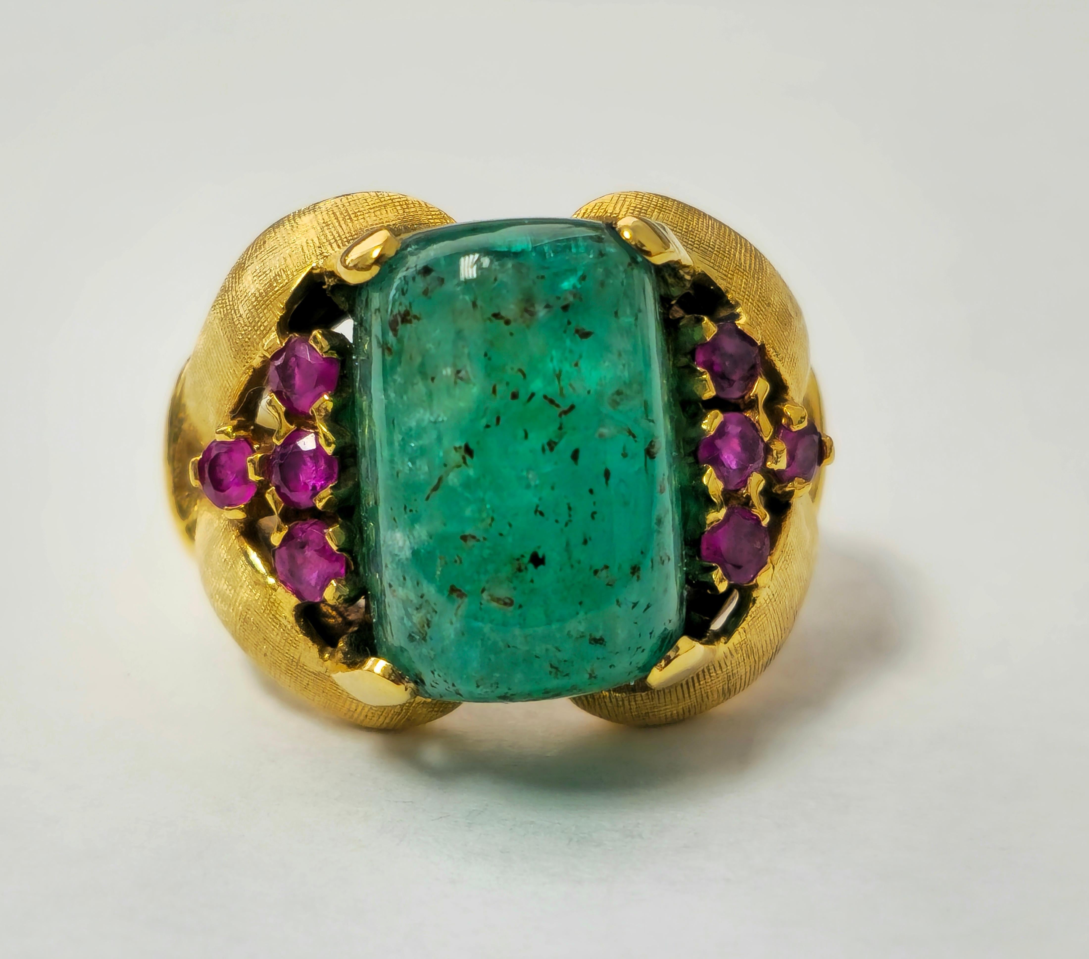 Fashioned in 14k yellow gold, this stunning vintage cocktail ring boasts a remarkable 12.11 carat sugar loaf-shaped Colombian emerald, paired with a total of 0.30 carats of round-cut rubies, all 100% natural earth mined gems. With a total weight of