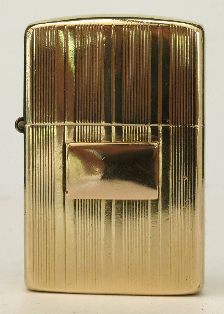 This rare flip top pocket lighter by Littal Lite with a 14-karat gold lighter case comes with a Zippo insert and an Art Deco designed gold case. Blank plaque ready for that special person's initials.