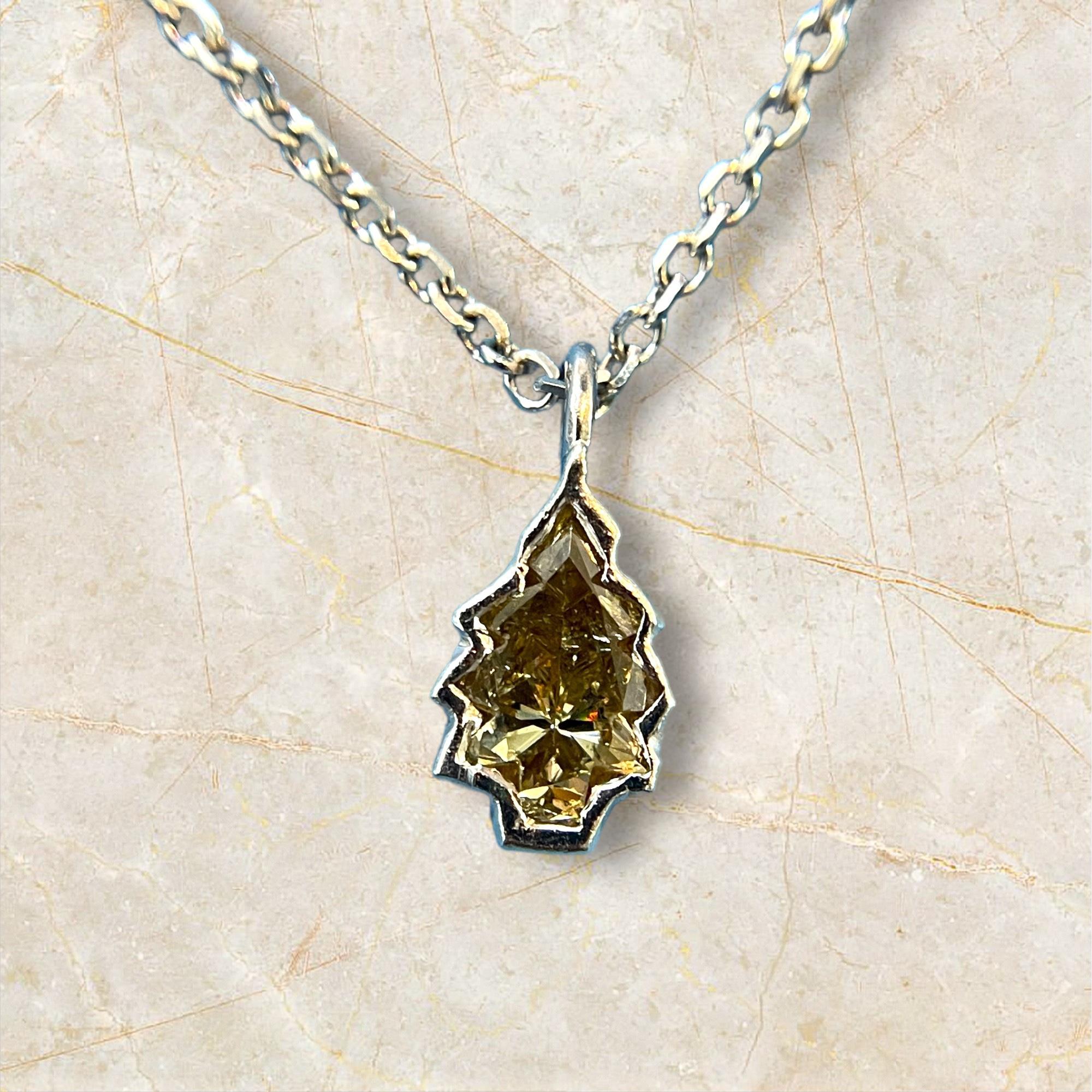 This stunning 14K white gold pendant showcases a beautifully crafted Christmas tree adorned with a brilliant 0.4-carat diamond at its center. Its unique design and radiant sparkle make it a standout piece for holiday celebrations and beyond. Whether