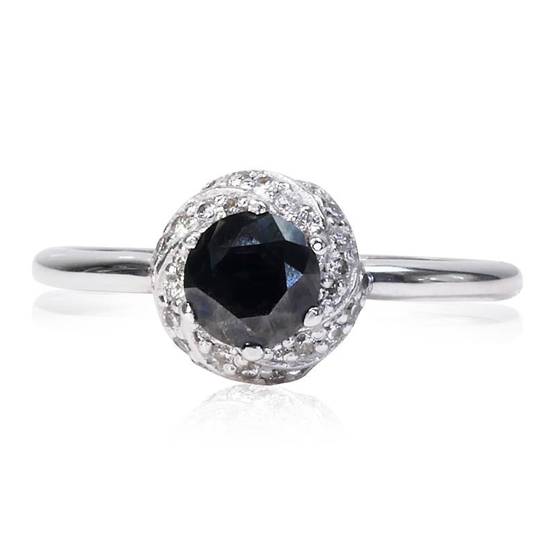 Stunning fancy black ring made from 14k white gold with 0.86 total carat of fancy round brilliant diamond and natural round brilliant diamonds. This ring comes with an AIG report and a fancy box.

-1 diamond main stone of 0.64 ct.
cut: round
color: