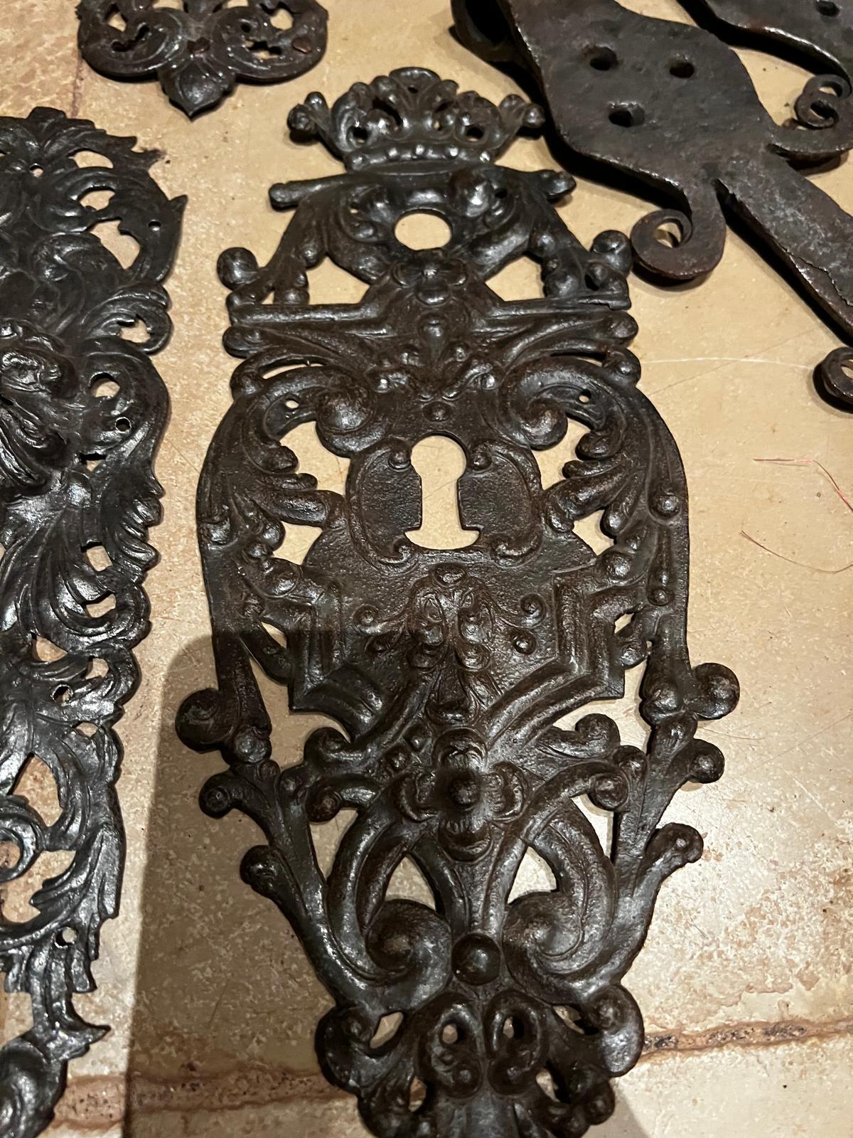 An exceptional collection of antique wrought iron door hardware dating from the Renaissance period, circa 16th century. These highly decorative pieces exemplify the artistry and craftsmanship of medieval and early Renaissance blacksmithing,