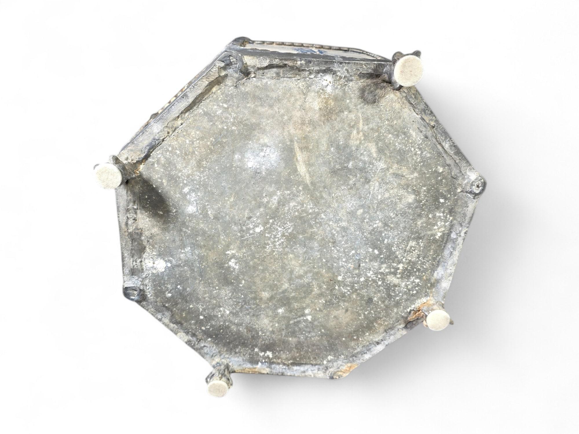 This exceptional 17th-century flower pot is a rare find, featuring authentic Delft porcelain tiles set in a hexagonal tin structure. Despite its age of approximately 400 years, the piece remains in very good condition, a testament to its