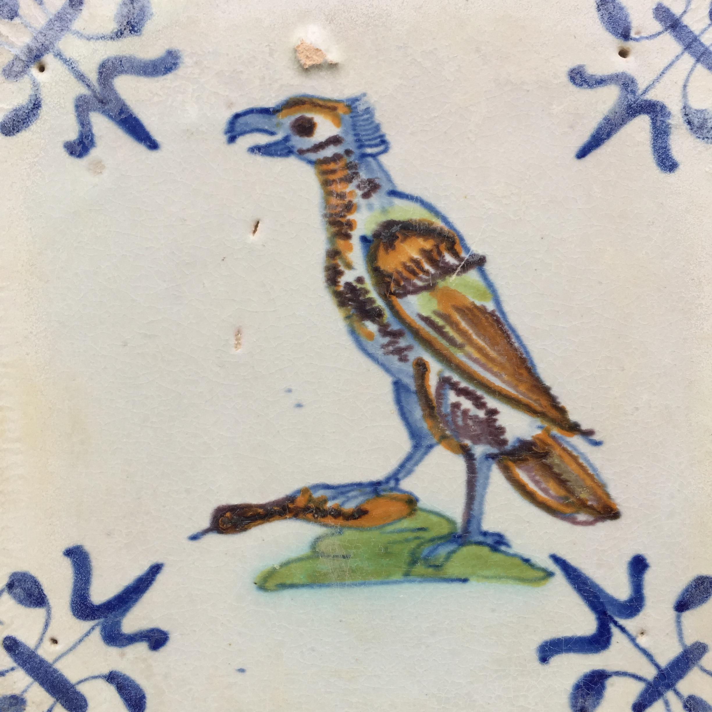The Netherlands
Gouda
Circa 1625 – 1650

A polychrome Dutch tile with the decoration of a proud hawk with a prey, a duck?, under his paw.
This tile was made in the city of Gouda by workshop ‘De Swaen’ (The Swan) of Willem Jansz Oliviersz