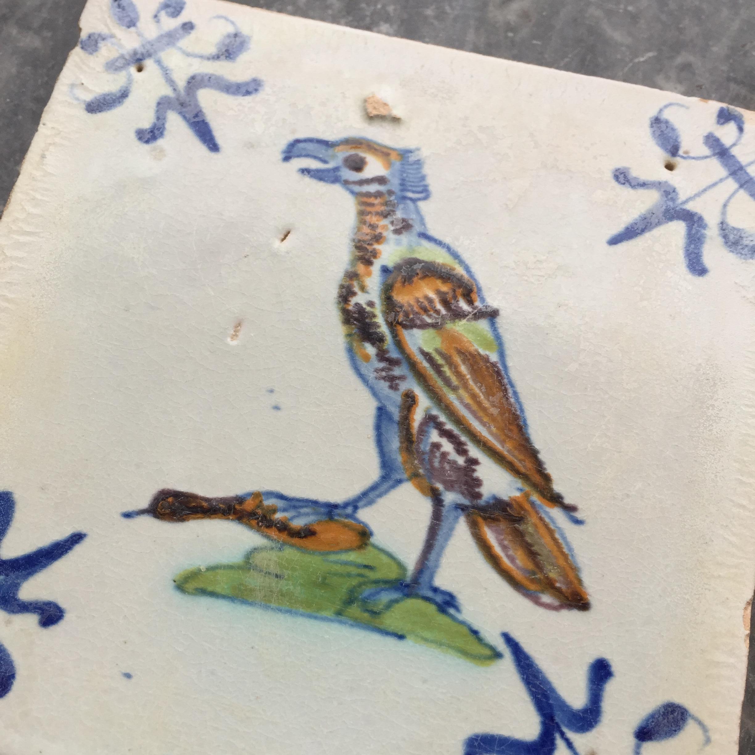 Fired Rare 17th Century Dutch Delft Tile with Decoration of a Predator Bird with Prey For Sale