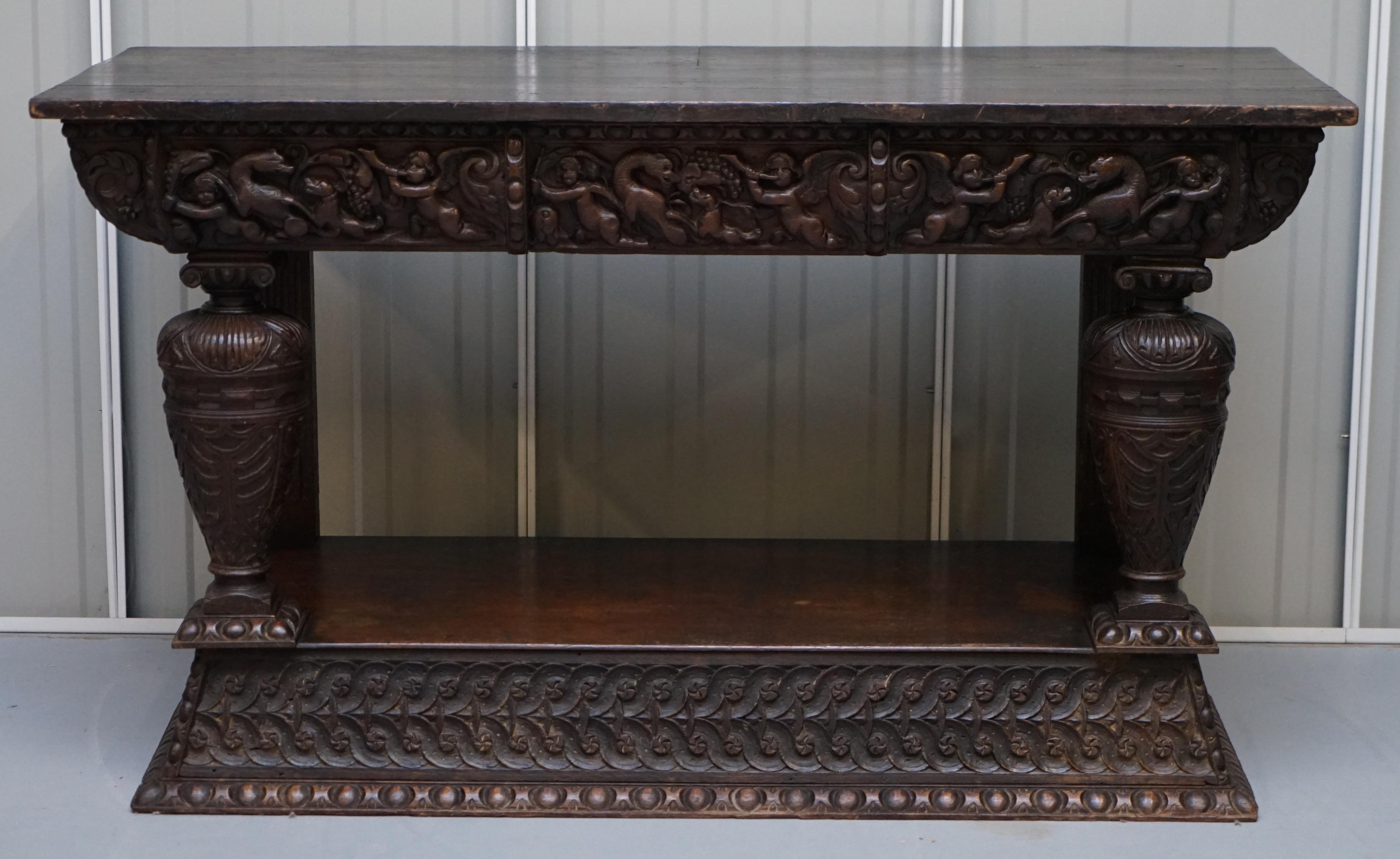We are delighted to offer for sale this stunning and very rare 17th century hand carved Italian console or serving table

A very good looking and decorative piece of Italian furniture. It is hand carved all over, you can see Cherub Angels playing
