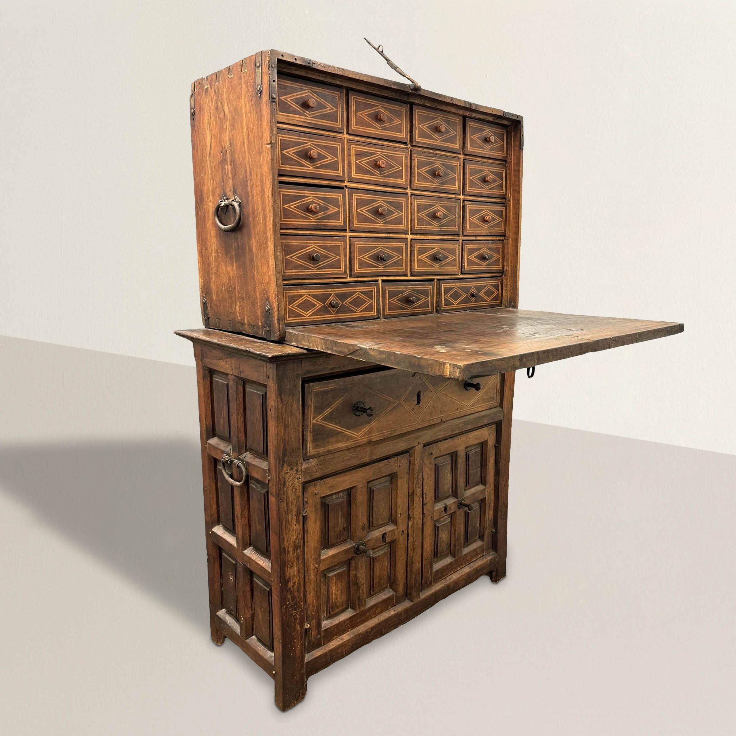Behold a rare and remarkable treasure from 17th century Spain: the vargueño. Crafted from solid one-inch thick walnut panels, this vargueño stands as a testament to the masterful craftsmanship of its time. The writing desk showcases intricate inlaid