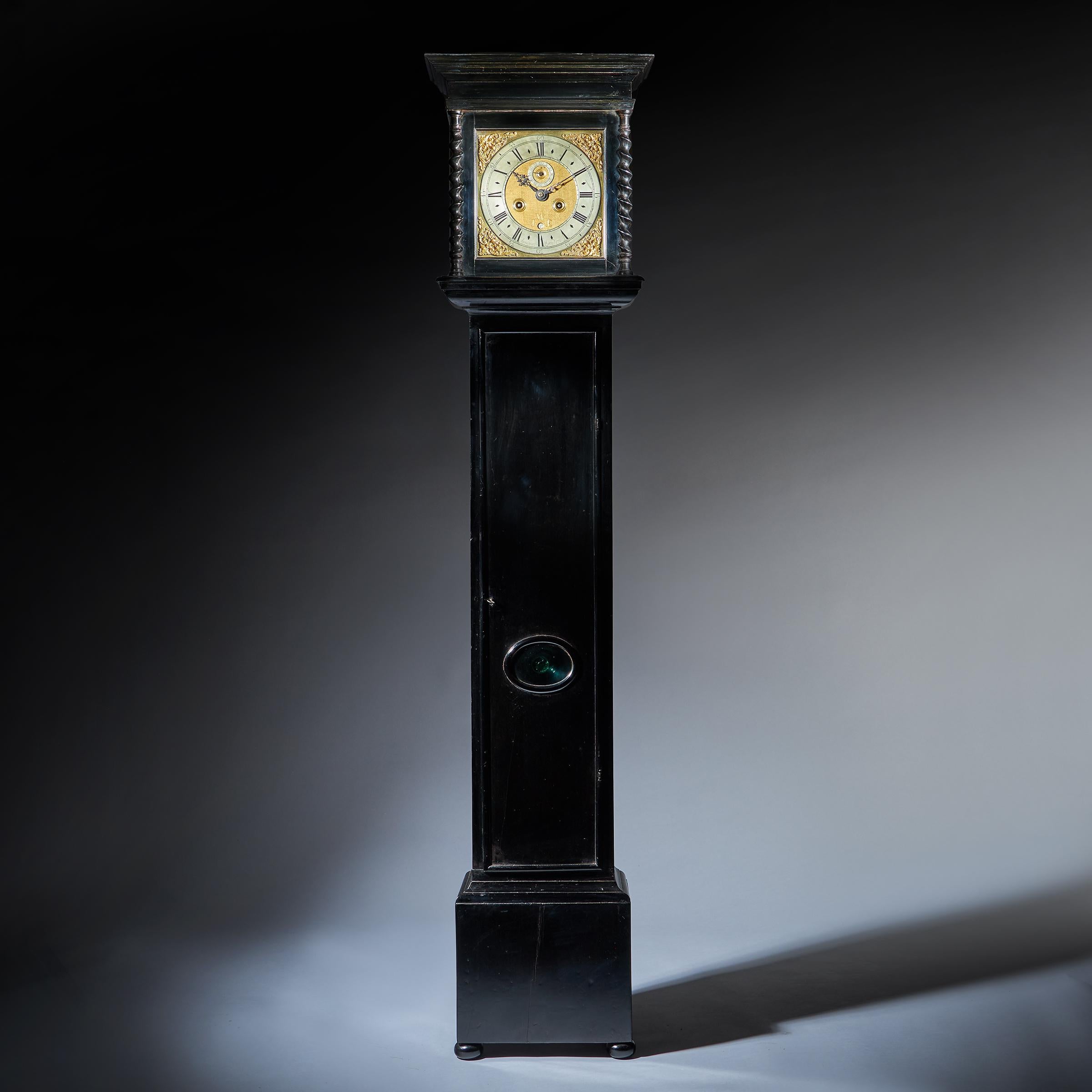 A rare, early English eight-day longcase clock signed on the chapter ring Aynsworth London, dating to the period c.1690-1700. 

The elegantly proportioned ebonised case, formerly with rising square hood now sliding, is framed with convex mouldings