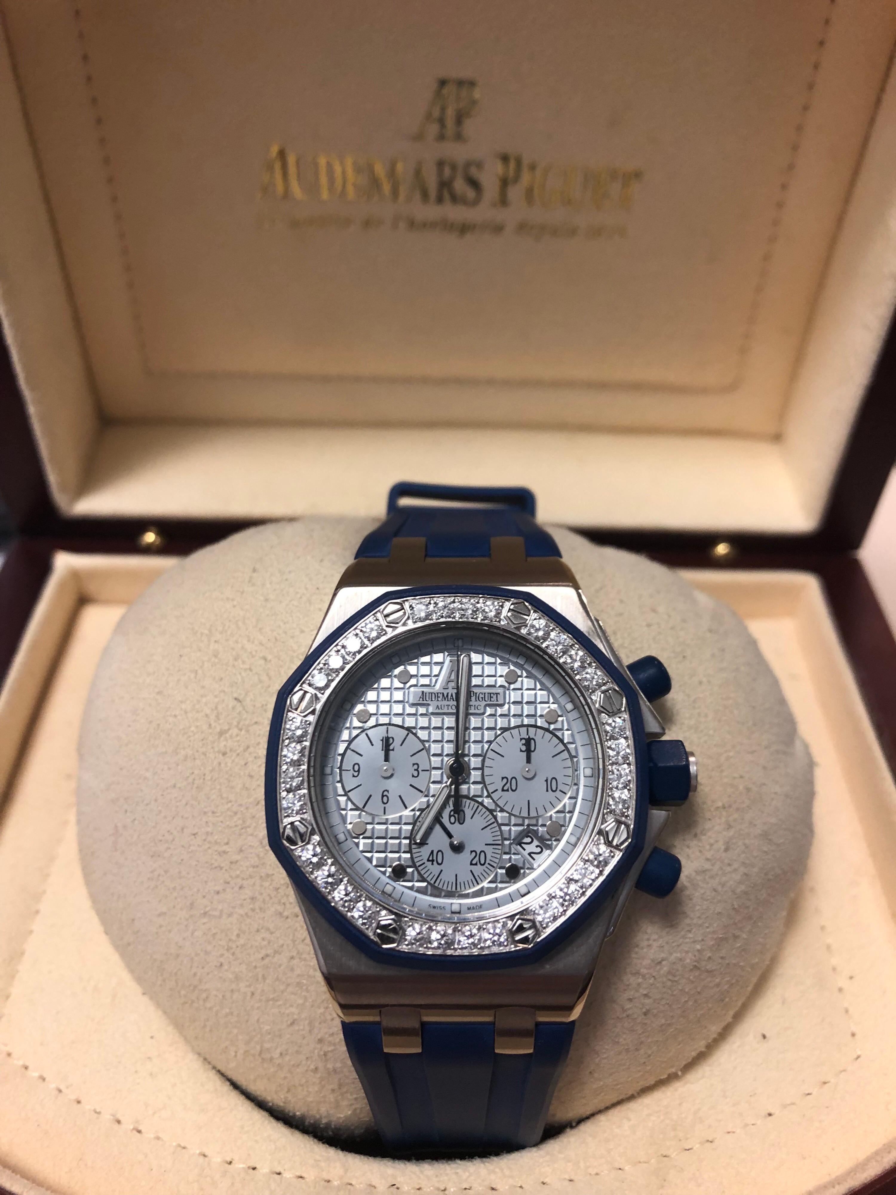 Rare 18 karat white gold royal oak ladies offshore. The watch is a 37mm chronograph featuring an automatic movement. Calibre 2120 & 2121. There are 37 diamonds on the bezel and a date display at the 4:30 position. Blue rubber AP strap and deployant