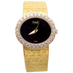 Rare 18 Karat Yellow Gold Lady's Stone Dial and Diamond Bezel Piaget Wrist Watch