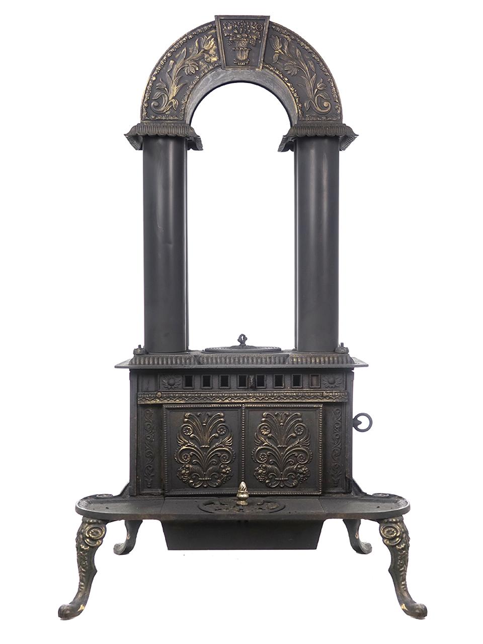 This is a stove that you will never see and the look is amazing. Its signed G.E.Waring - No.1. It was made in New York in 1840. It cast iron with four copper vertical tubes.