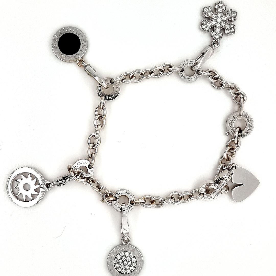 Bvlgari Charm Bracelet

Bvlgari rare discontinued collectors 18ct White Gold, Five Charm Bracelet in a Bvlgari Box.

The bracelet has an approx 7” chain with interlocking rings marked Bvlgari, this piece is original and not a copy and has purchase