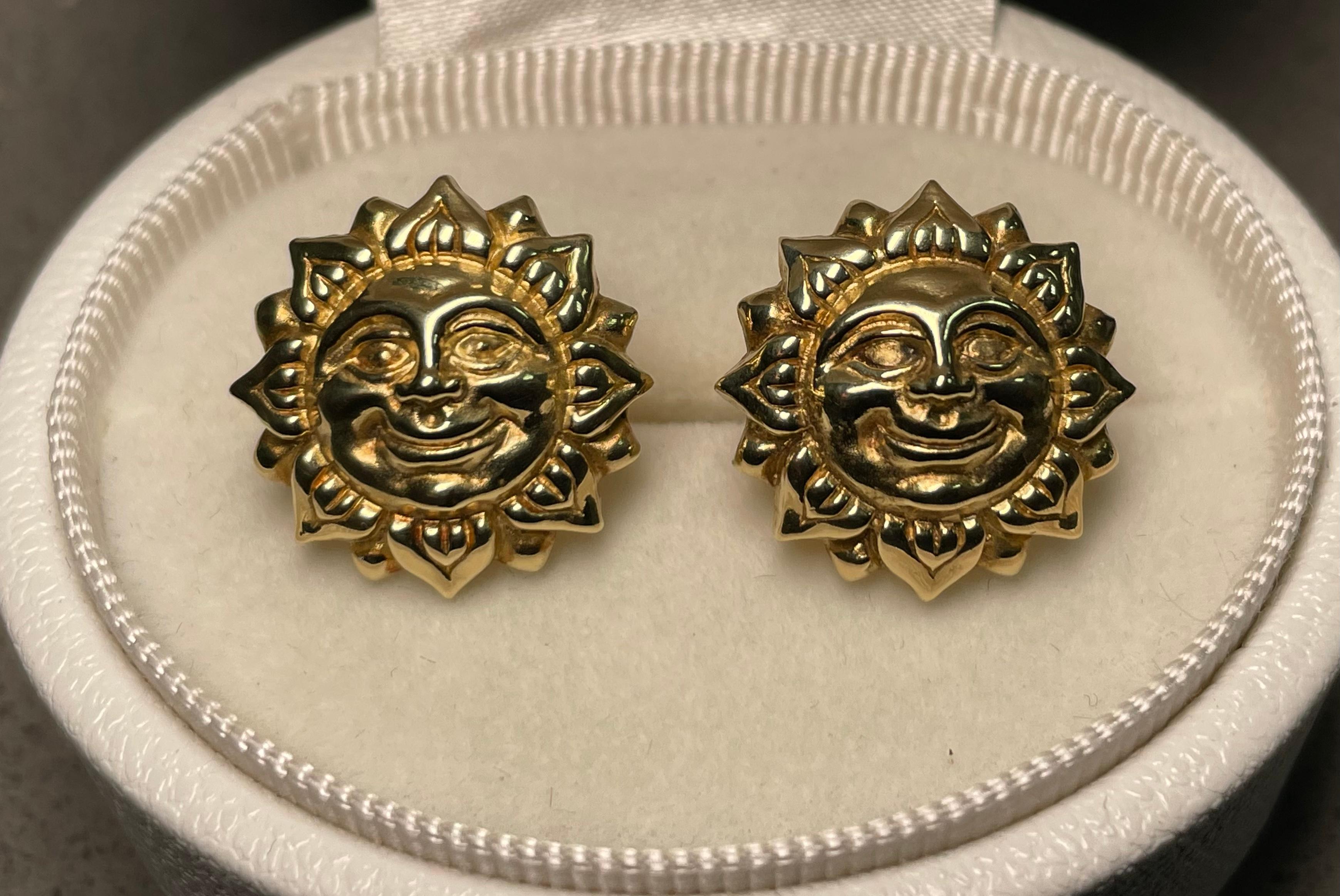 This is an 18k yellow gold pair of whale back cufflinks. They depict a smiling sun face. They are hallmarked 18k in their links. They are rare and full of details.
