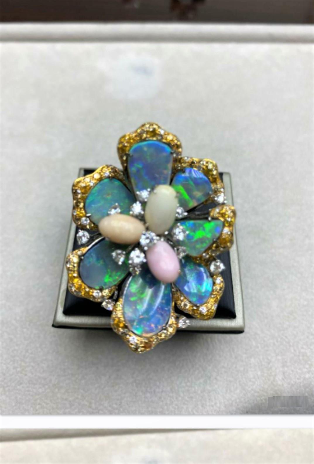 The Following Item we are Offering is this Magnificent 18KT Gold Large Extremely Rare Conch Pearl and Fancy Yellow Diamond Black Opal Ring. This Gorgeous Ring features 3 Gorgeous Conch Pearls  at center flanked with Fancy Yellow and White Diamonds!!