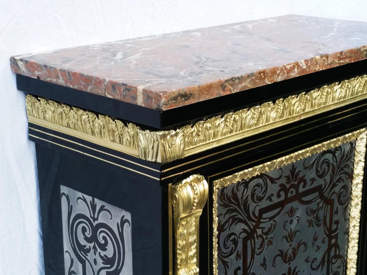 Rare 18th century Boulle Marquetry cabinet in ebony veneer with a rich inlaid Boulle pewter and palisander all over the facade and sides. Thick gilt bronze ornaments, acanthus cornice leaves, original marble in a good condition, blackened interior