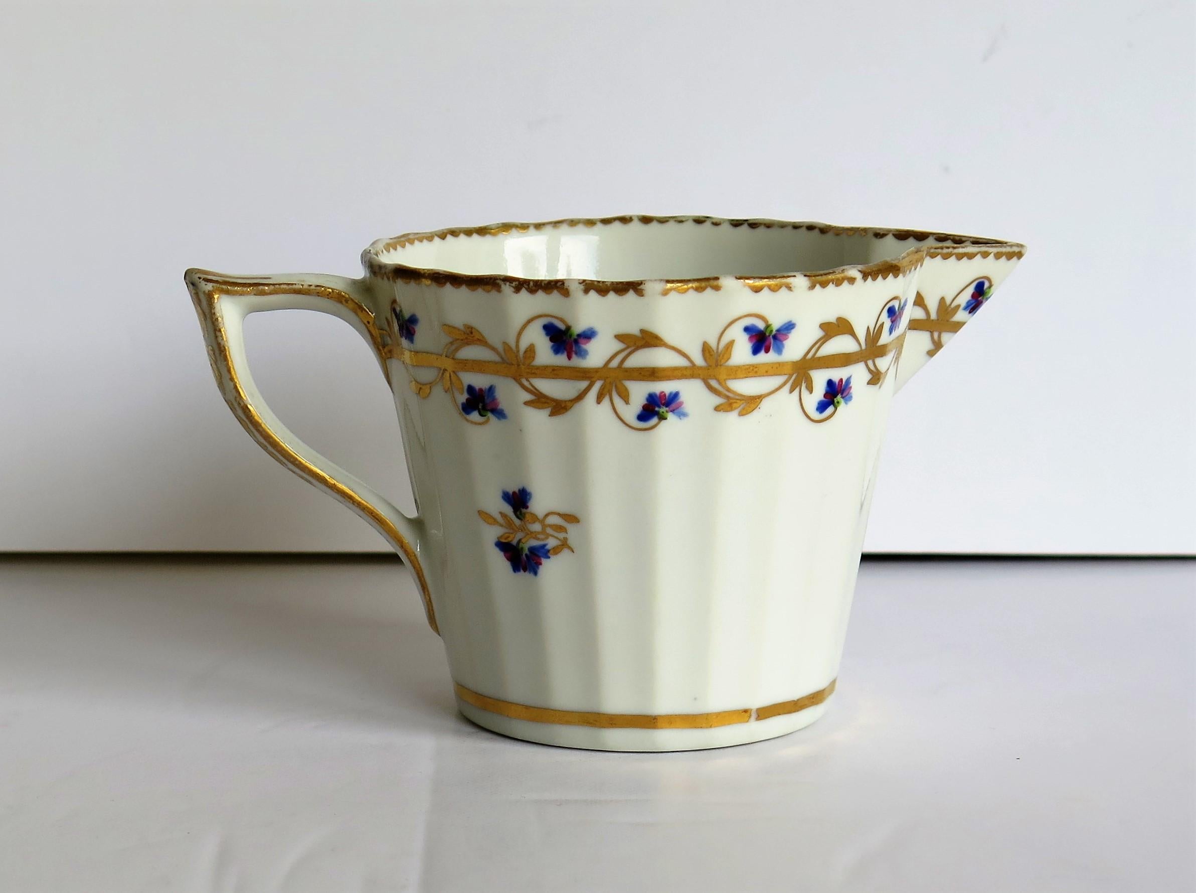 This is an exquisite, porcelain cream jug or creamer, hand painted with an early pattern number 111 and made by the Derby factory, in the reign of George 111 in the late 18th century, circa 1785-1790.
 
Early 18th century creamers by Derby are
