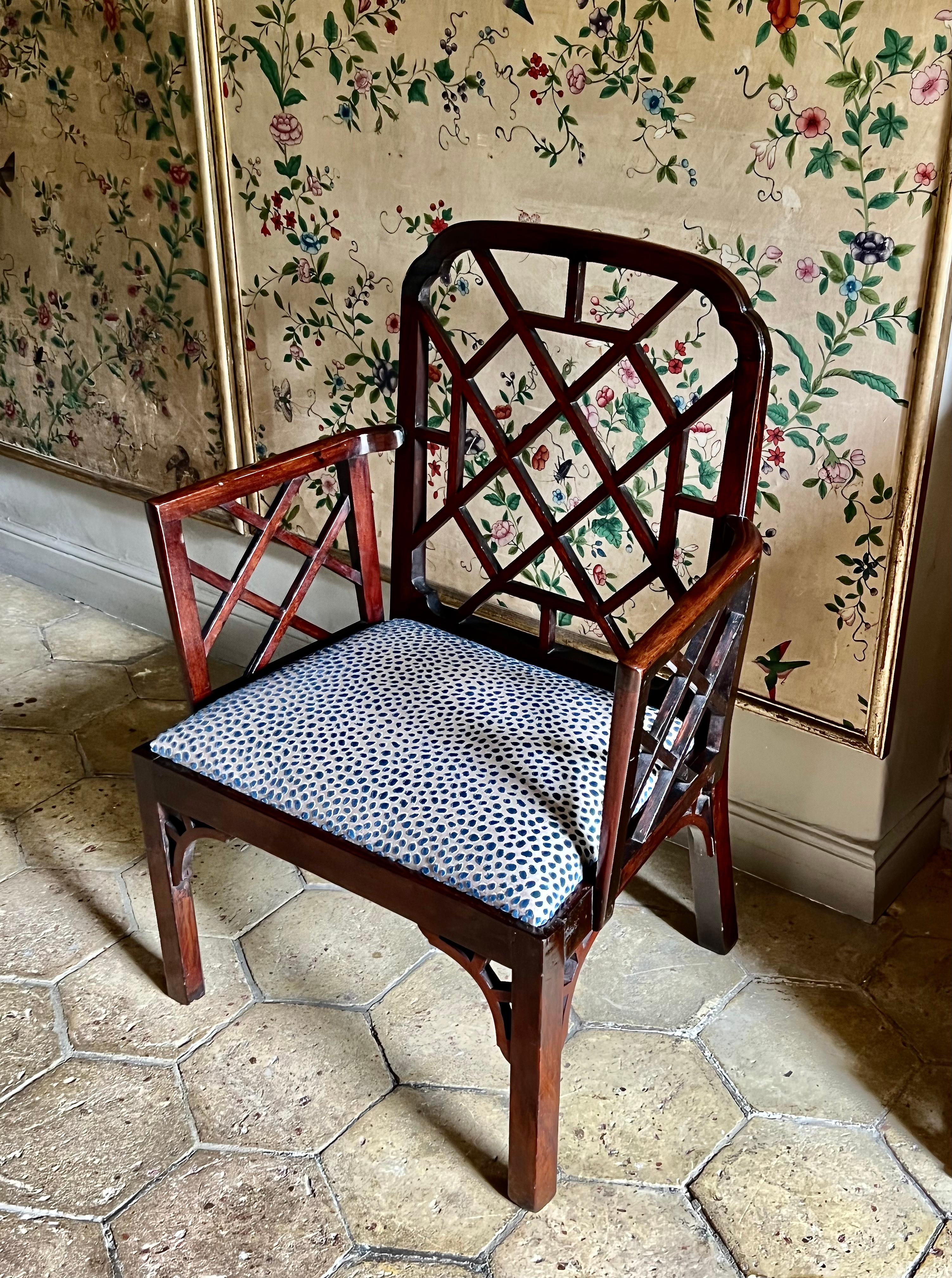 An 18th-century mahogany Cockpen armchair. George III period, ca 1762.

Rare and sophisticated, this antique Cockpen armchair retains its chinoiserie open-fretwork frame and angle brackets.

Some minor historic restorations entirely commensurate