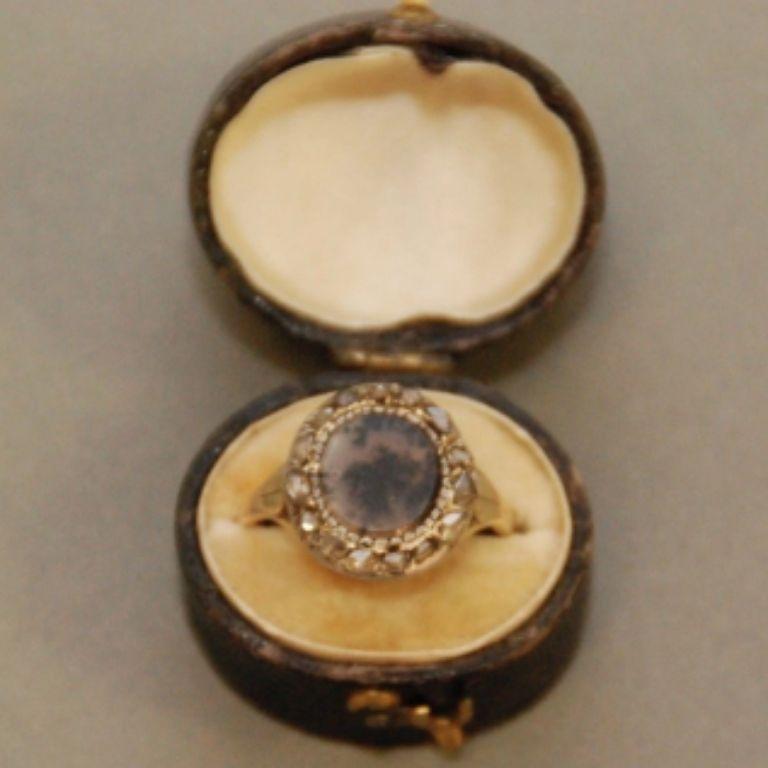 A beautiful and rare antique Georgian ring, circa 1780. Featuring a moss agate surrounded byrose cut diamonds, 14-karat yellow gold and silver. See Oxford's Asmolean Museum for a similar example. From the estate of a Surrey lady.