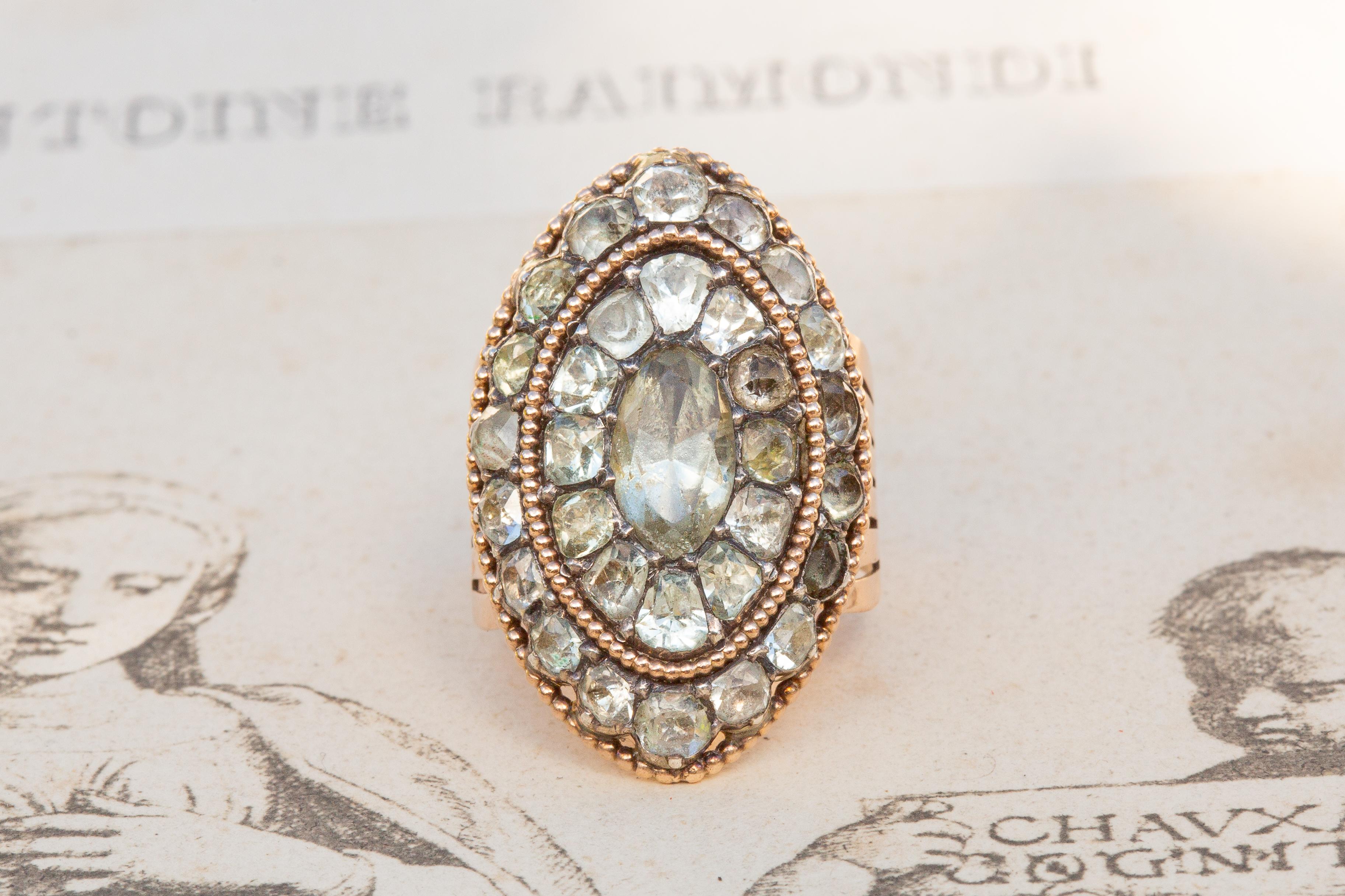 A rare Portuguese 18th century ‘minas novas’ rock crystal cluster ring, circa 1770. A lovely example of Georgian period Portuguese jewellery, this marquise-shaped ring was crafted in 15K gold and displays excellent craftsmanship. The larger central