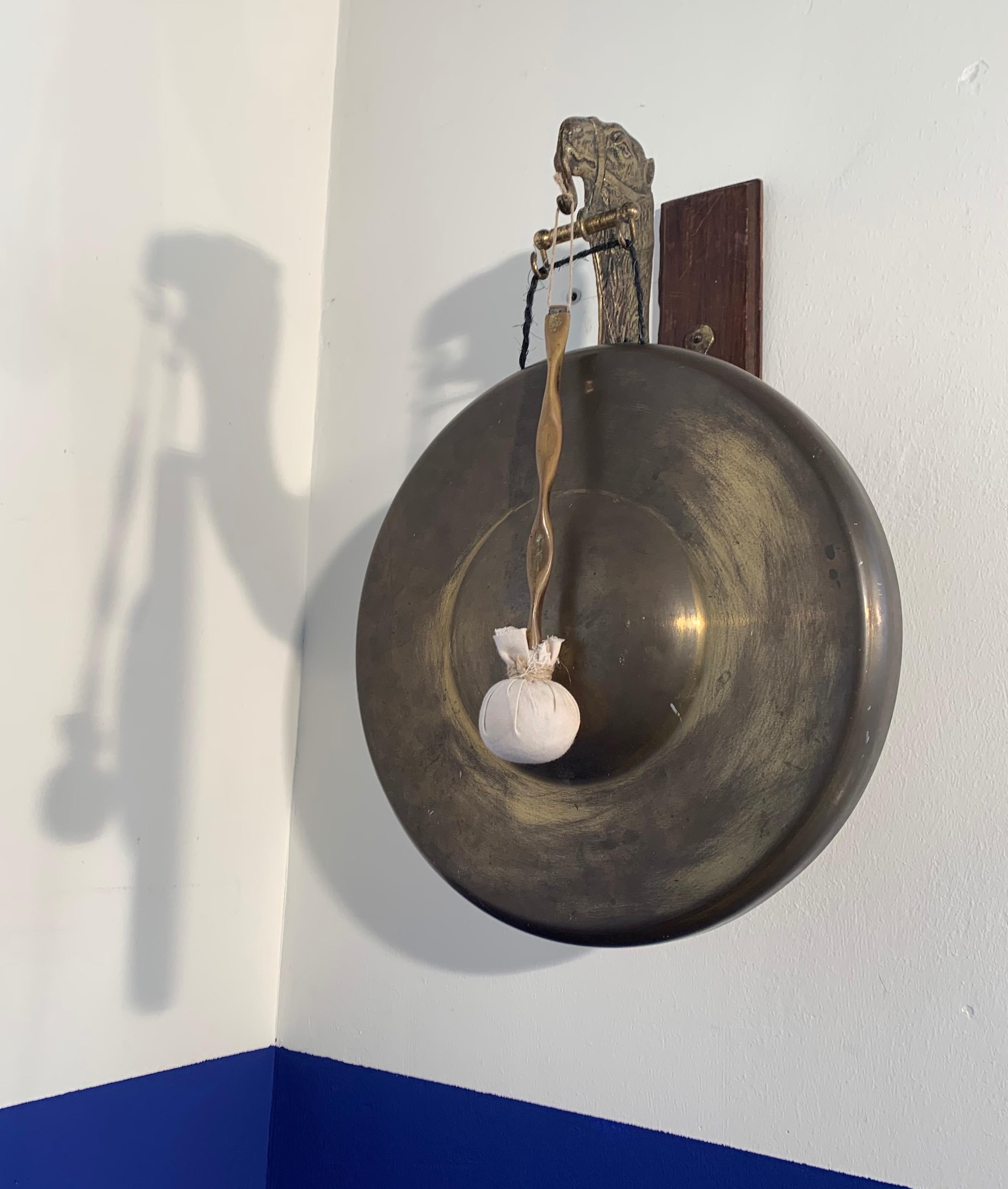 Very rare and striking (pun intended) Arts & Crafts gong.

This totally original house gong with a camel sculpture even comes with the original and perfect condition striker. The beautifully patinated camel and gong are a real joy to look at and