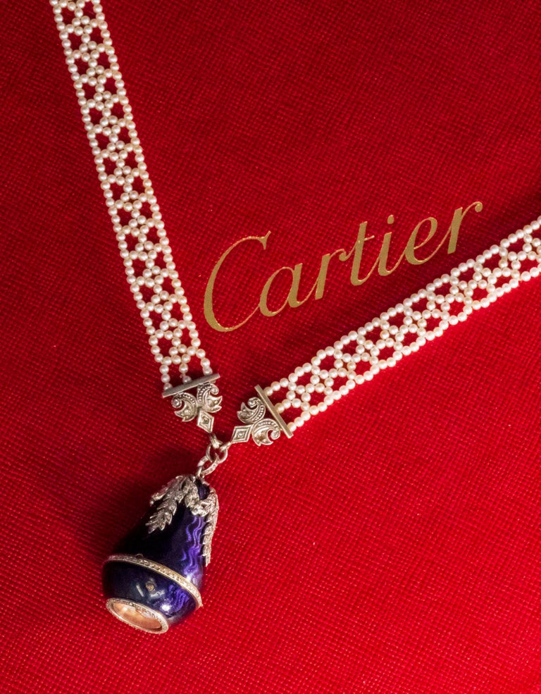 The present necklace pendant watch is the only known example of its kind in the marketplace and is a very important and rare Cartier, belle époque platinum diamond violet “Russian Ray” Engine turned guillioche deep purple enamel pear bell form