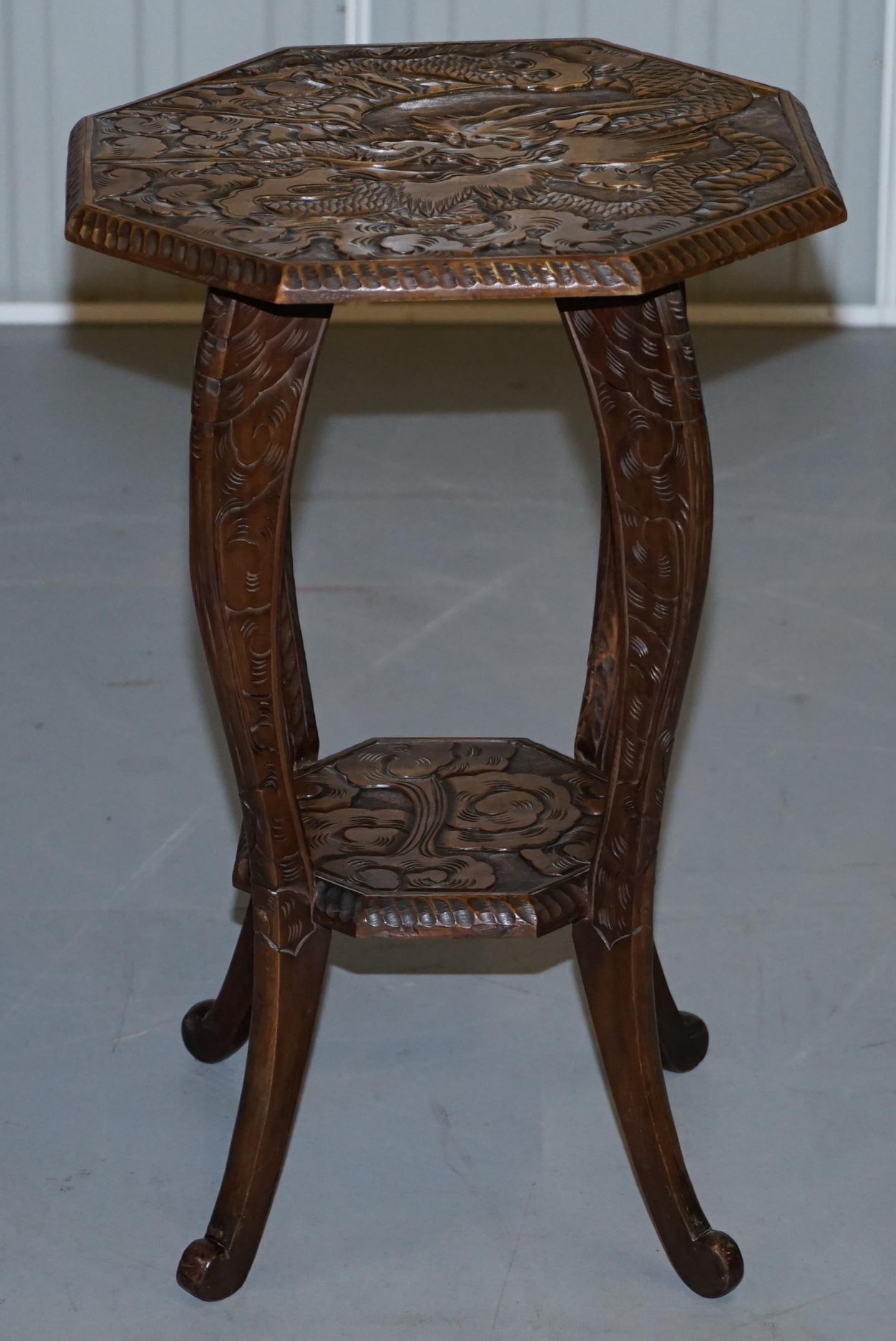 We are delighted to offer for sale this lovely rare Liberty’s London 1905 Japanese dragon mahogany side table

A good looking piece, its hand carved from top to bottom with floral detailing and a large ornate dragon to the top

We have deep