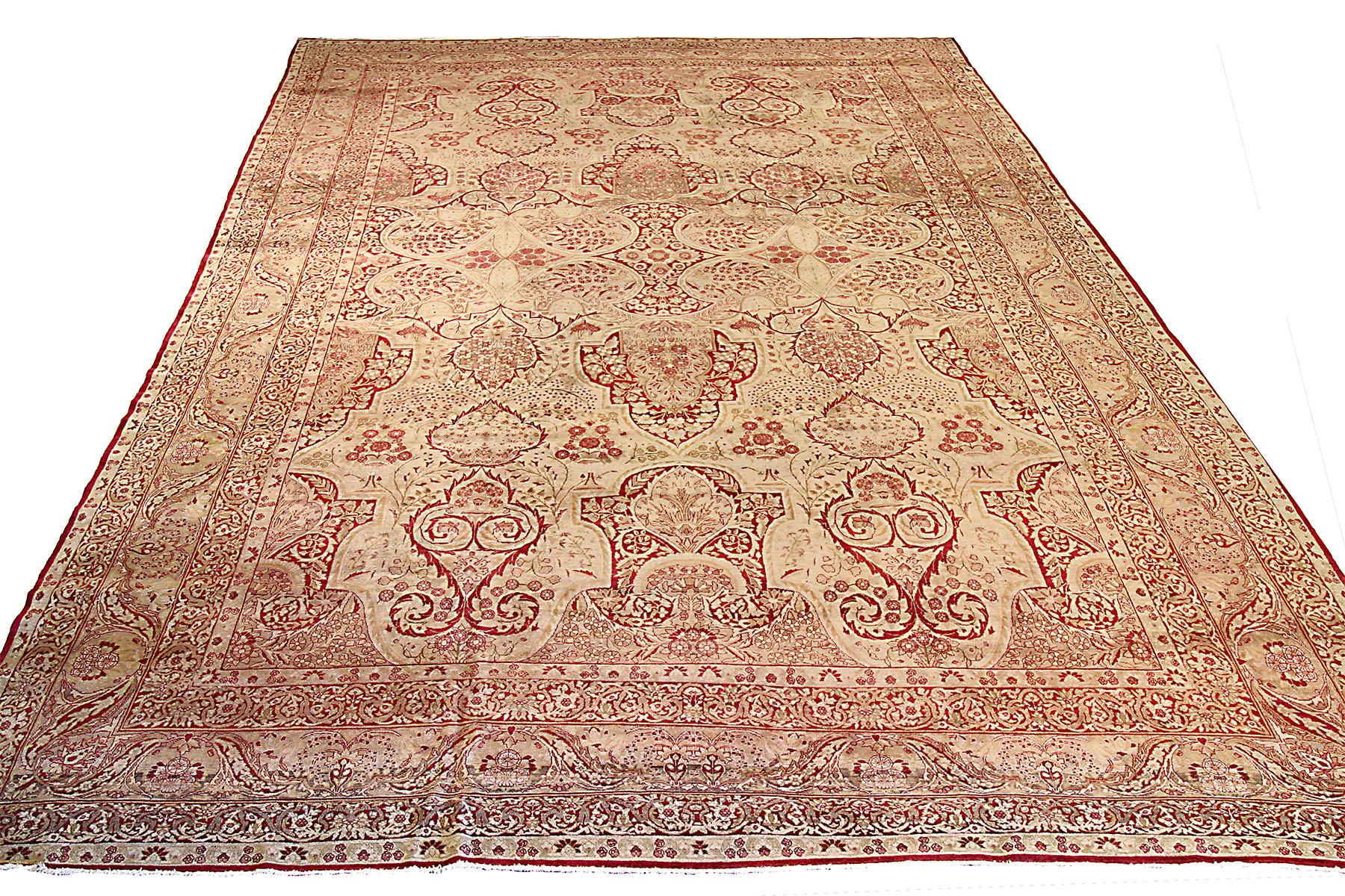 Rare antique Persian rug handwoven in the 1920s from the finest sheep’s wool and colored with all-natural vegetable dyes that are safe for humans and pets. It’s woven by master weavers of Yazd featuring an elegant ensemble of floral designs in deep