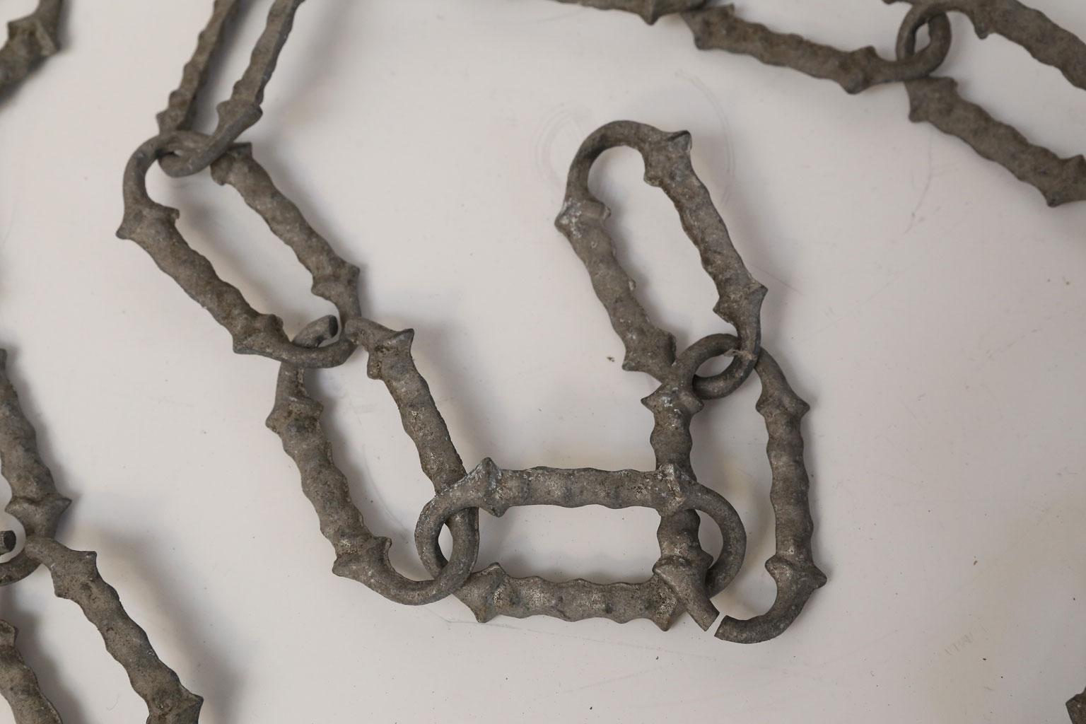 Rare 1920s decorative aluminum chain: three sets of continuous linked antique Belgian aluminum chain. Attractive cast links, each link measures 3.5 inches high x 1.88 inches wide x .25 inches deep. Every other link can be opened to adjust length of