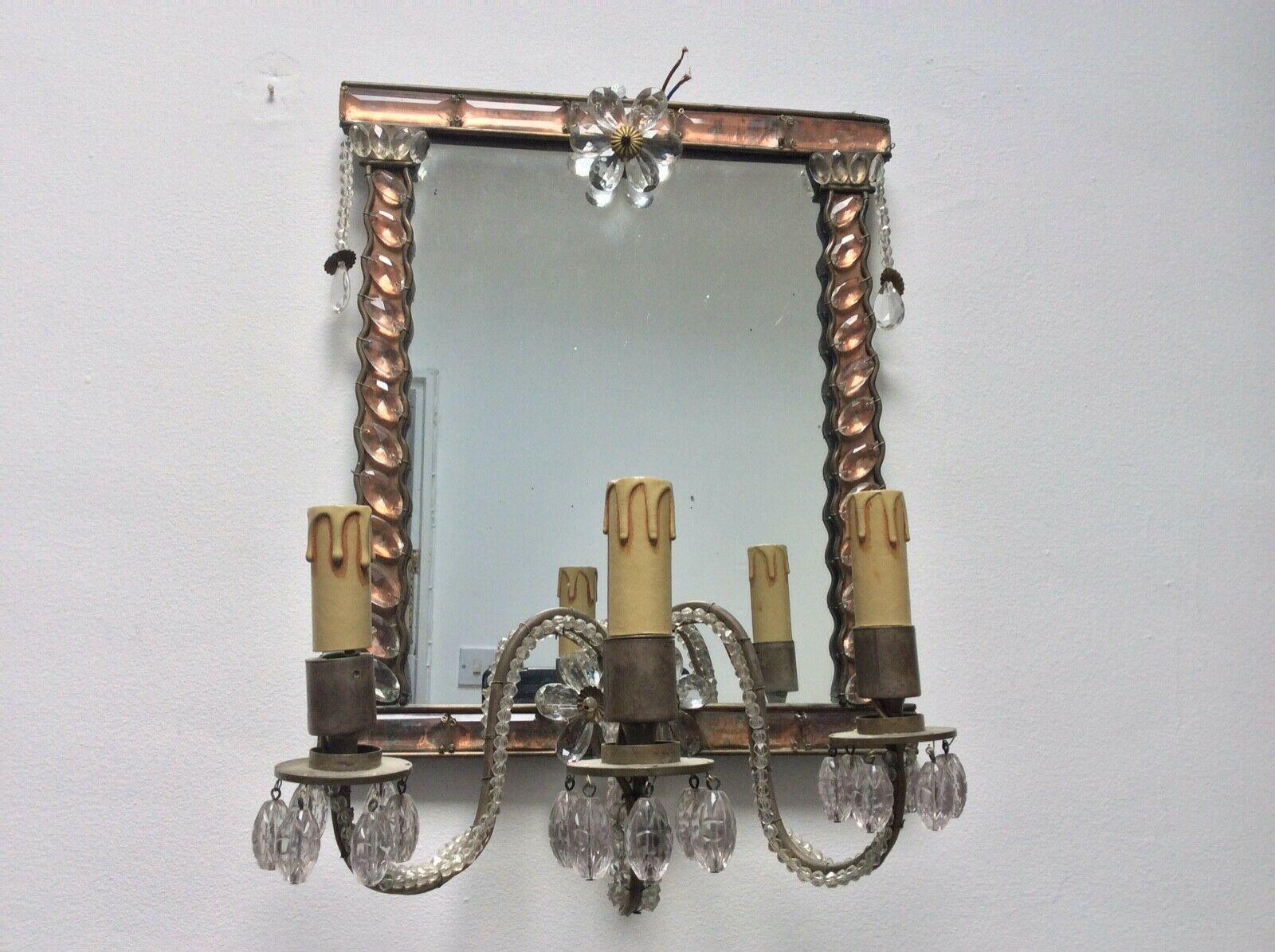 I purchased this beauty in Ireland at a great antique store. 1920 Maison Bagues Wall Mirror/ Sconce / Wall Lamp. Crystal flowers and beautiful crystal against interior copper for a stunning pink effect.
I have only seen one of these.
