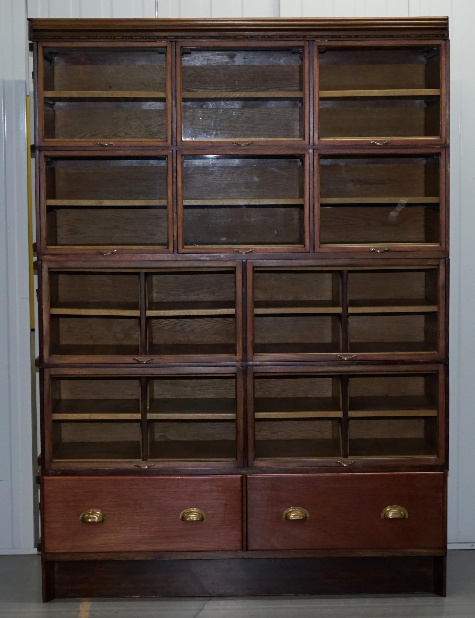 We are delighted to offer for sale this very rare original 1920’s solid oak with glass retractable doors stackable haberdashery cabinet

A very well made and functional piece, these cabinets were designed for formal gentleman’s retailers, you
