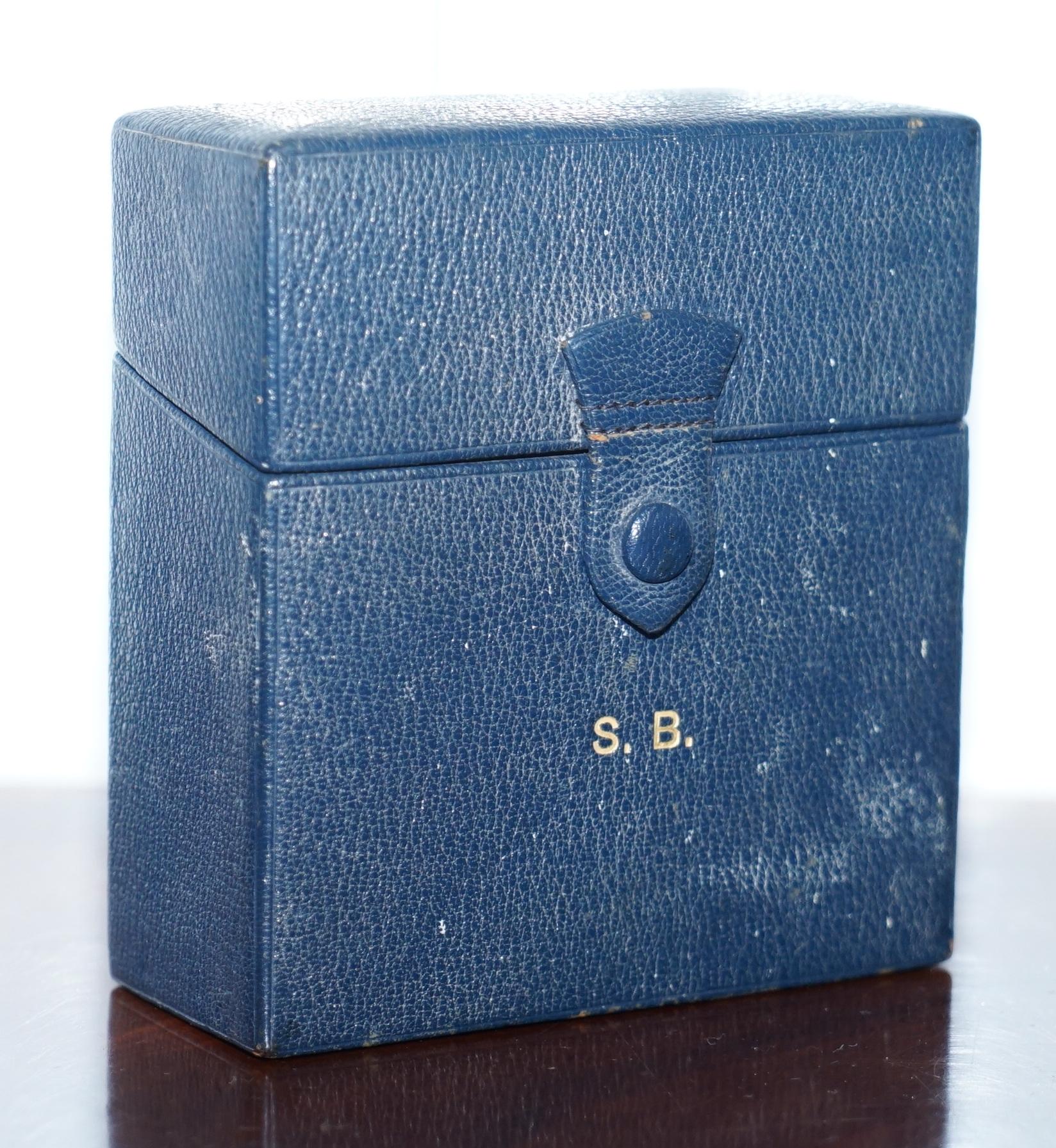 We are delighted to offer for sale this stunning 1929 blue leather travel case with two sterling silver capped cologne bottles all made by Asprey London

A very good looking and well-made set retailed by one of the finest silversmiths in the