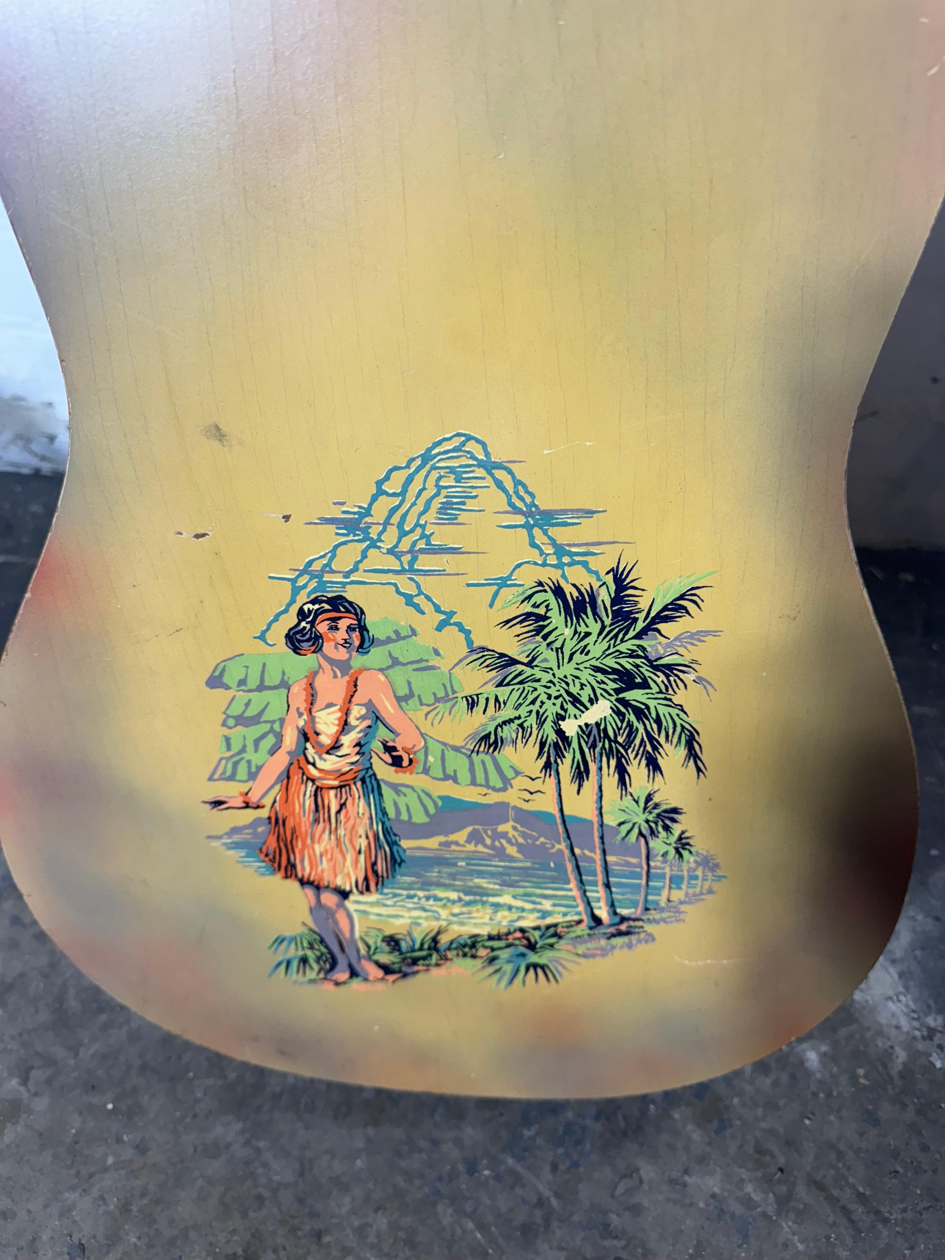  Wonderful 1928 / 1929 wood bodied National Triolian with Hula Girl back stencil. Beautiful finish /patina. Guitar in very good original condition. One of the cleanest I have ever seen. Tuners all original..Not certain ,but may be the original case.