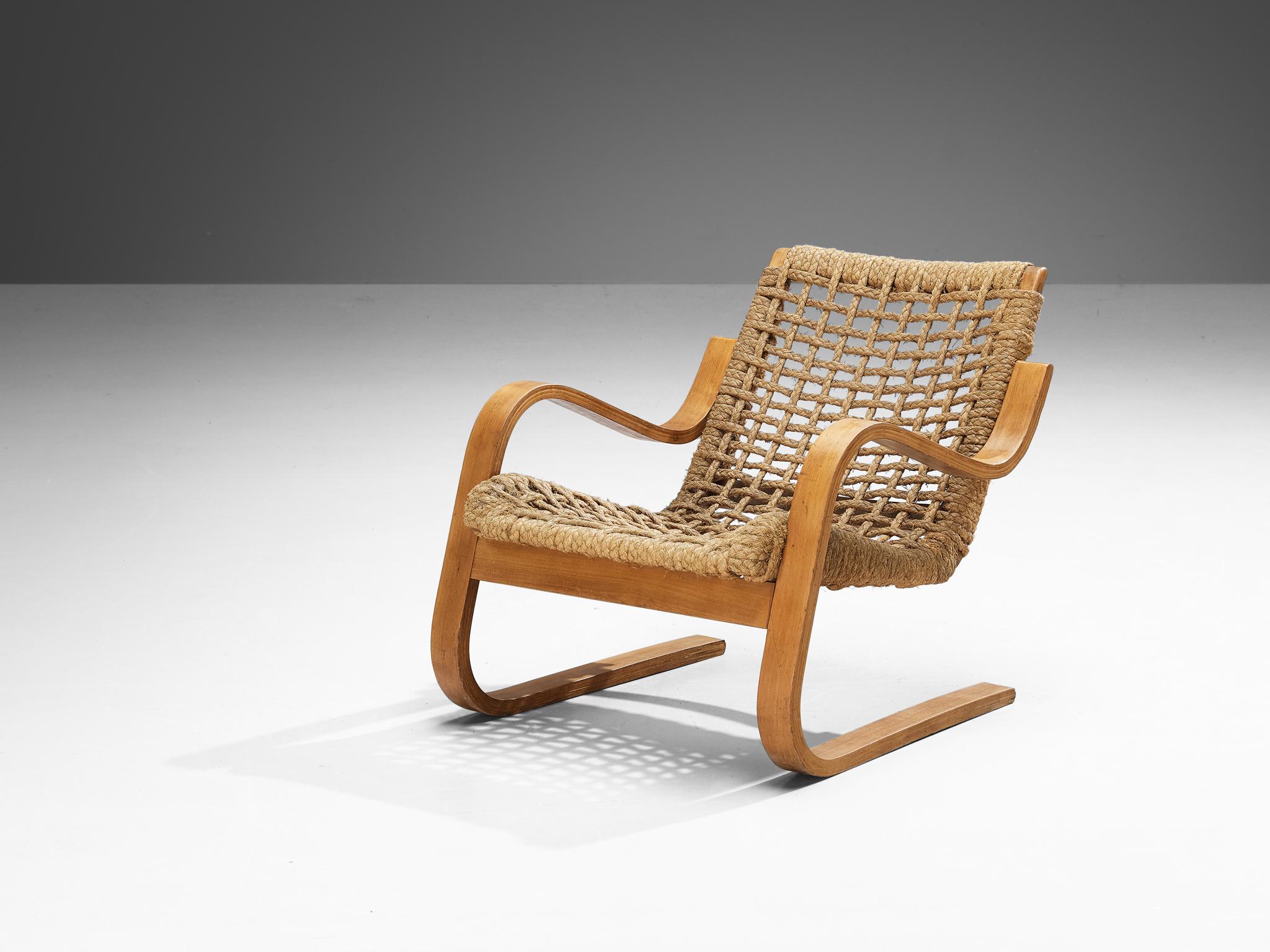 Alvar Aalto for Stylclair, lounge chair, beech plywood, braided straw, France, 1930s 

We present a rare lounge chair designed by Alvar Aalto, produced by Stylclair under the license from Wohnbedarf. Aalto's furniture first appeared in France around