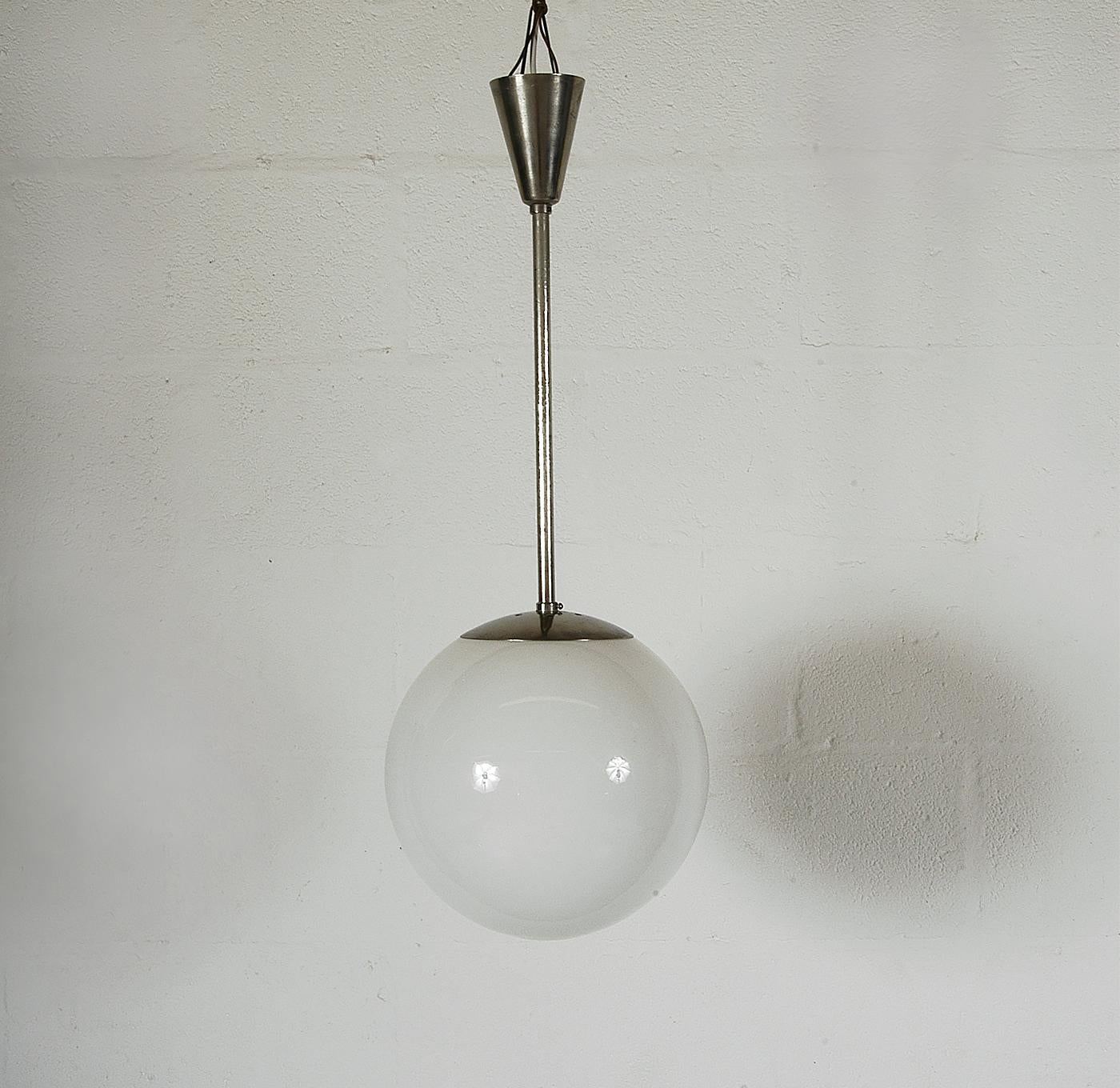 This classic 1930s chrome and opaque glass ceiling light is an iconic Bauhaus / Modernist light - the Ultralux U14 - designed by English designer, A.B Read for Troughton & Young (Lighting) Ltd of Knightsbridge, London. Comprising of an original